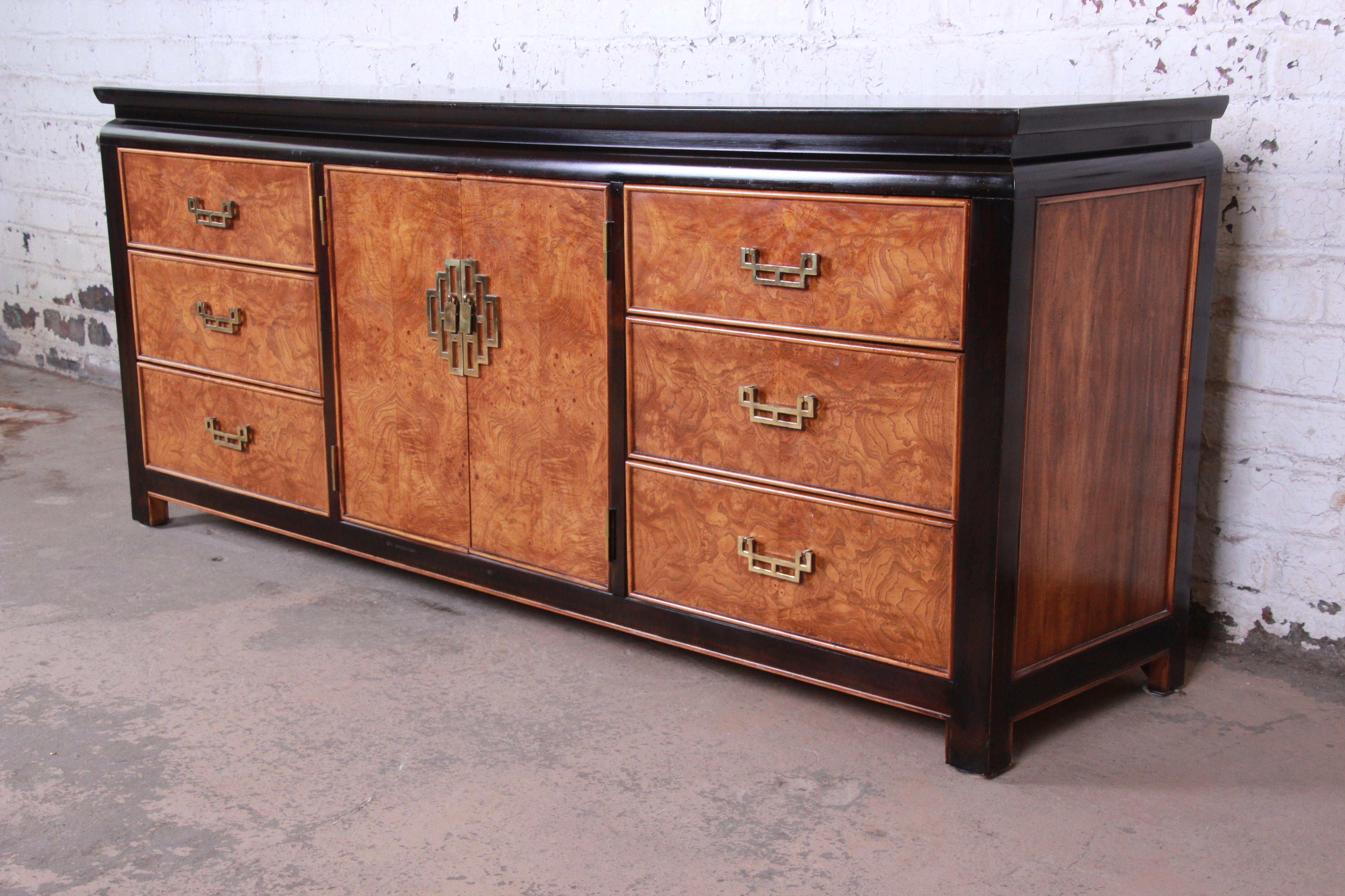 Offering an exceptional Century Furniture black lacquered and burl wood chinoiserie long dresser or credenza. The piece is from the popular Chin Hua line and features a beautiful burl wood encased in black lacquer. It features three large drawers on
