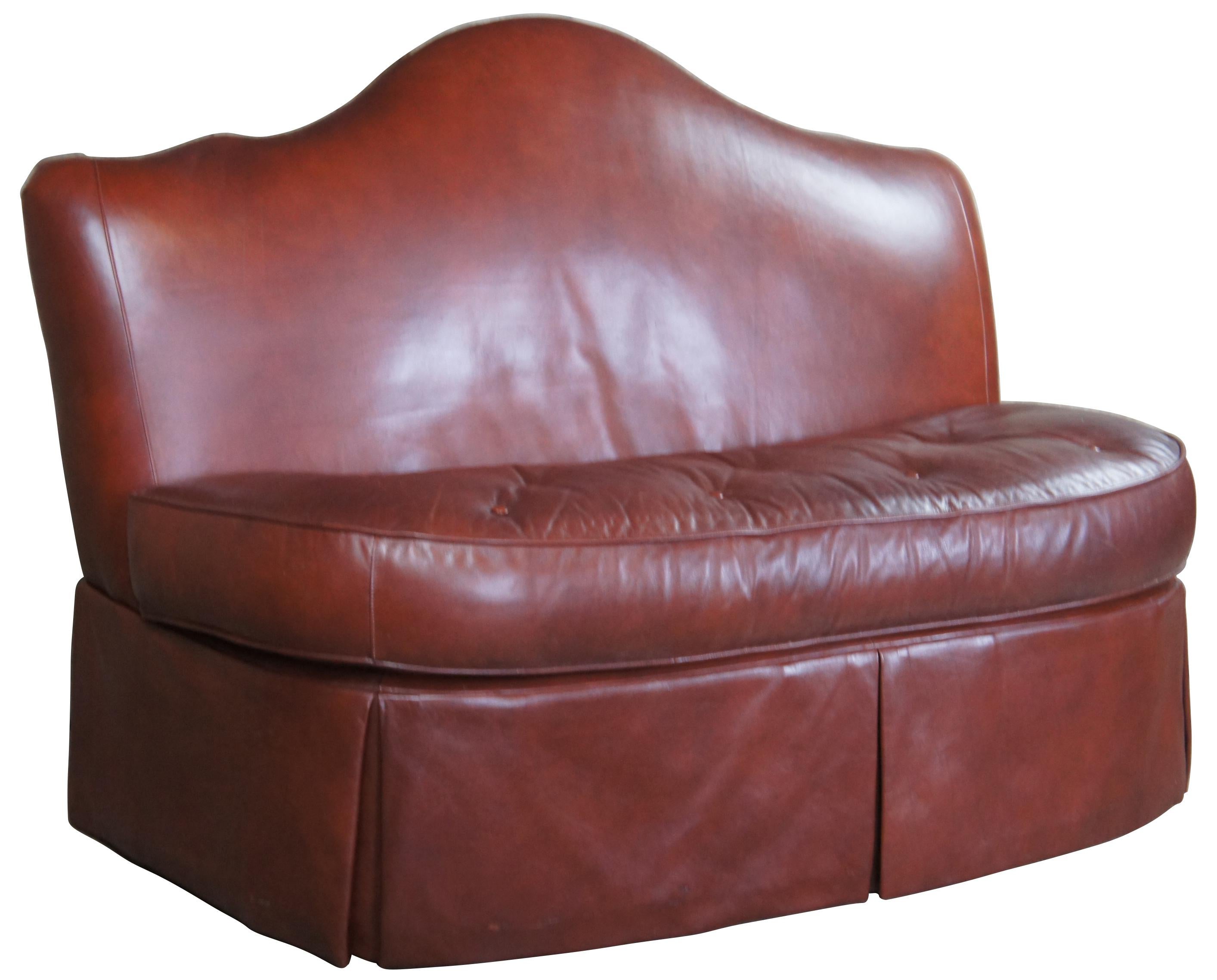 Century Furniture Camelback banquette/bench. Made from a warm brown leather with tufted kidney shaped seat. Front legs on casters for ease of movement.
 