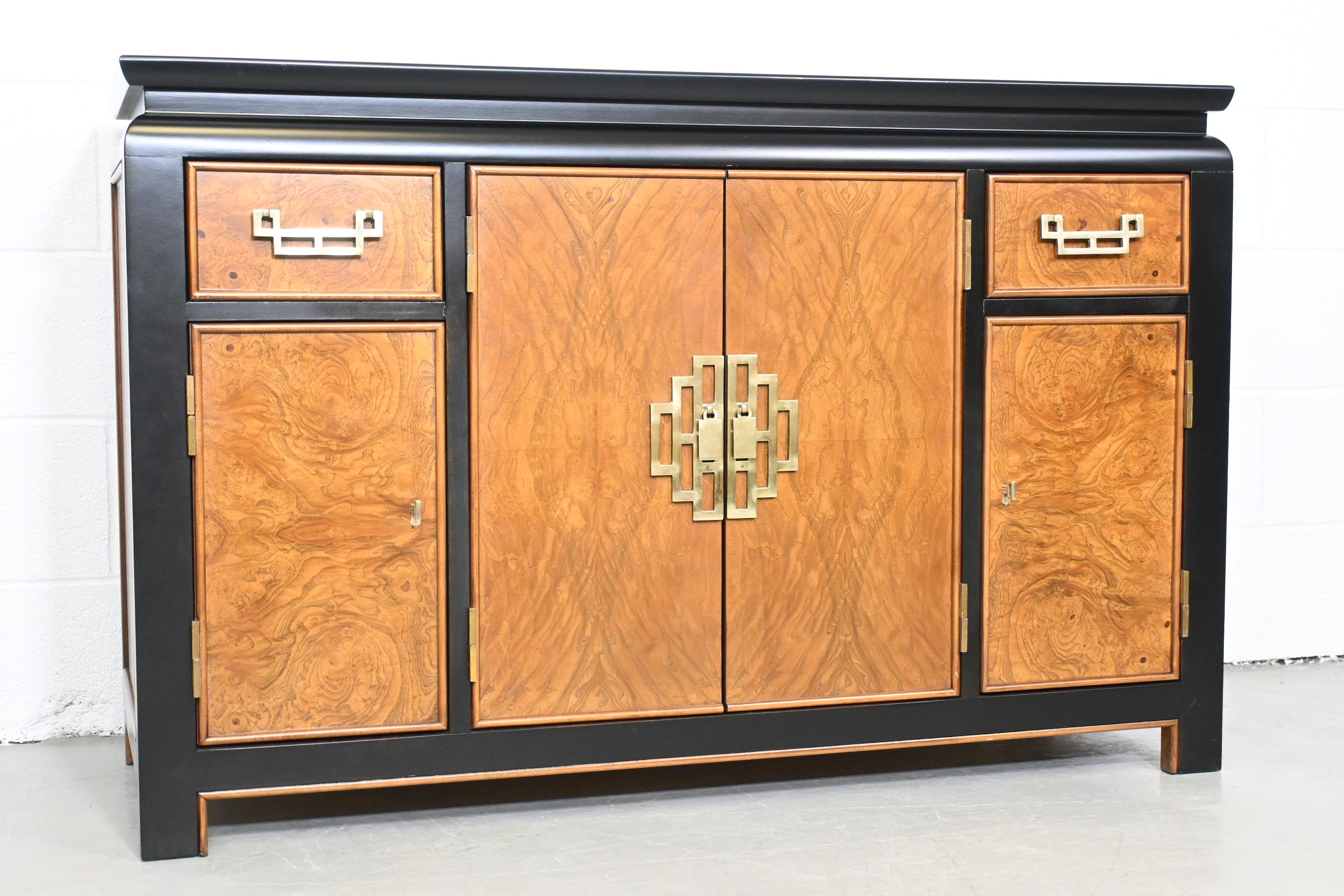Century Furniture Chin Hua by Raymond Sobota Chinoiserie credenza or bar cabinet

Century Furniture, USA, 1970s

Measures: 48 Wide x 18.5 Deep x 31.13 High.

Burl wood design with black lacquer trim and brass pulls. Unique design allows use as