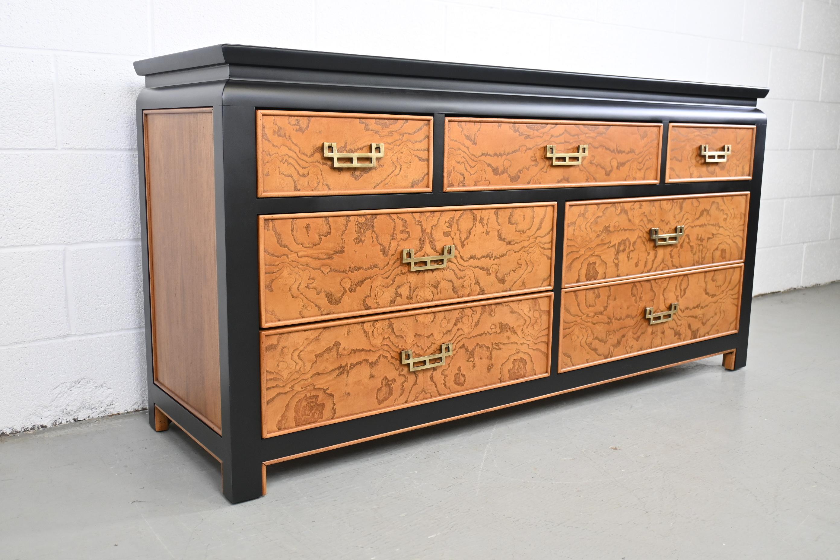 Century Furniture Chin Hua by Raymond Sobota seven drawer dresser

Century Furniture, USA, 1970s

62 Wide x 18.5 Deep x 31.38 High.

Burl wood design with black lacquer trim and brass pulls.

Professionally refinished. Excellent condition