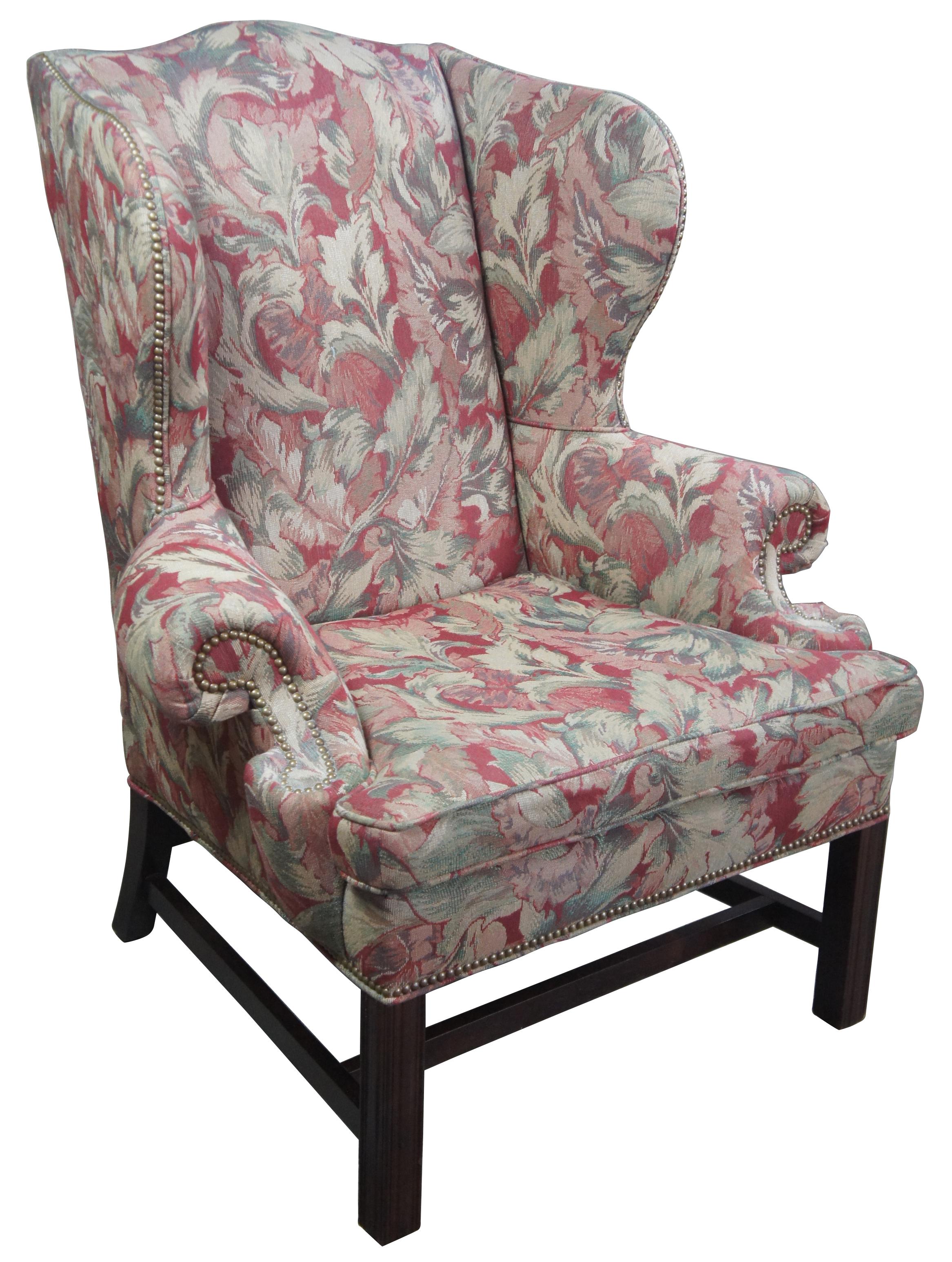 Century Furniture Chippendale style floral wingback armchair with nailhead trim

Vintage Century Furniture floral wingback arm chair. Features a slight camelback with rolled arms, nailhead trim and floral upholstery. Upholstered by Century