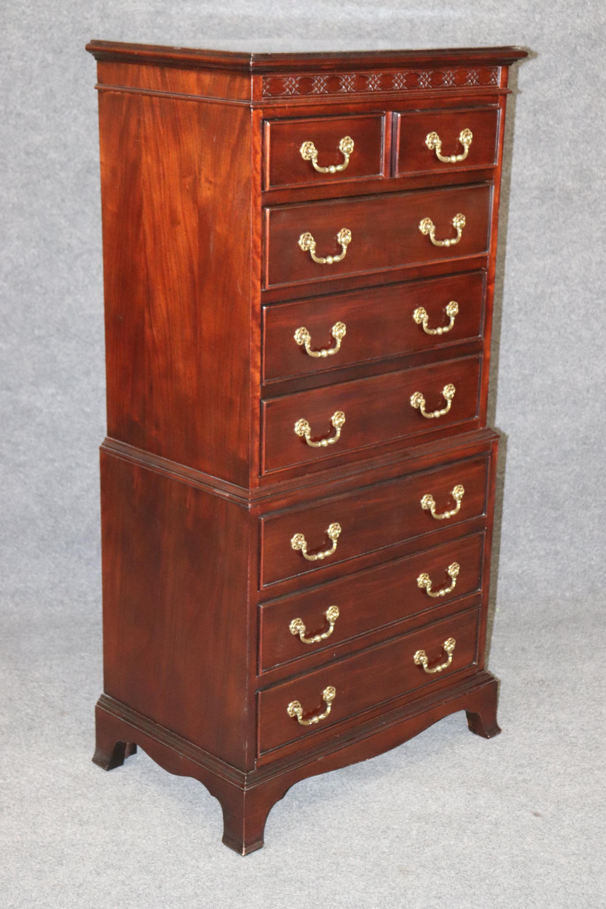 This is a gorgeous solid mahogany and brass Chippendale style high chest of smaller proportions and stature. This piece is in good vintage condition and has only minor signs of age and use and no significant scratches or issues to mention. The