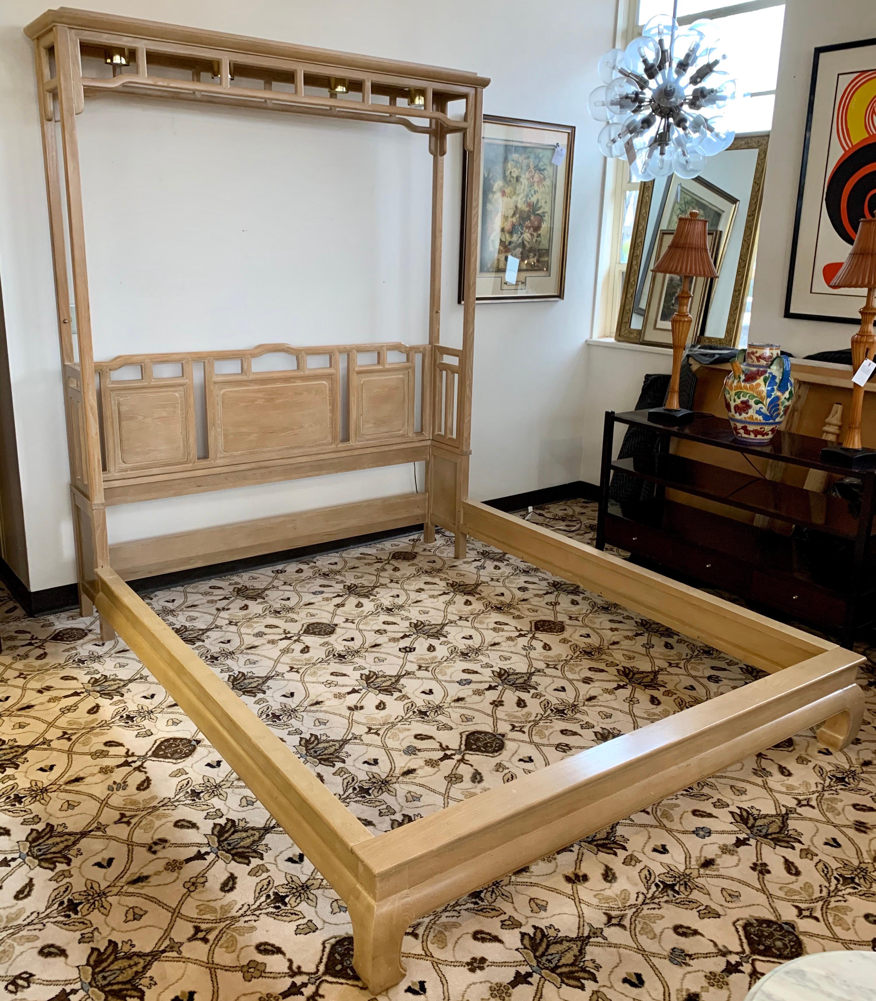 Coveted and rare Ray Sabota designed Asian inspired pagoda queen size bed manufactured by Century
Furniture, North Carolina, USA in the 1970s. This queen size set features headboard, footboard, rails and attached four light fixtures that are