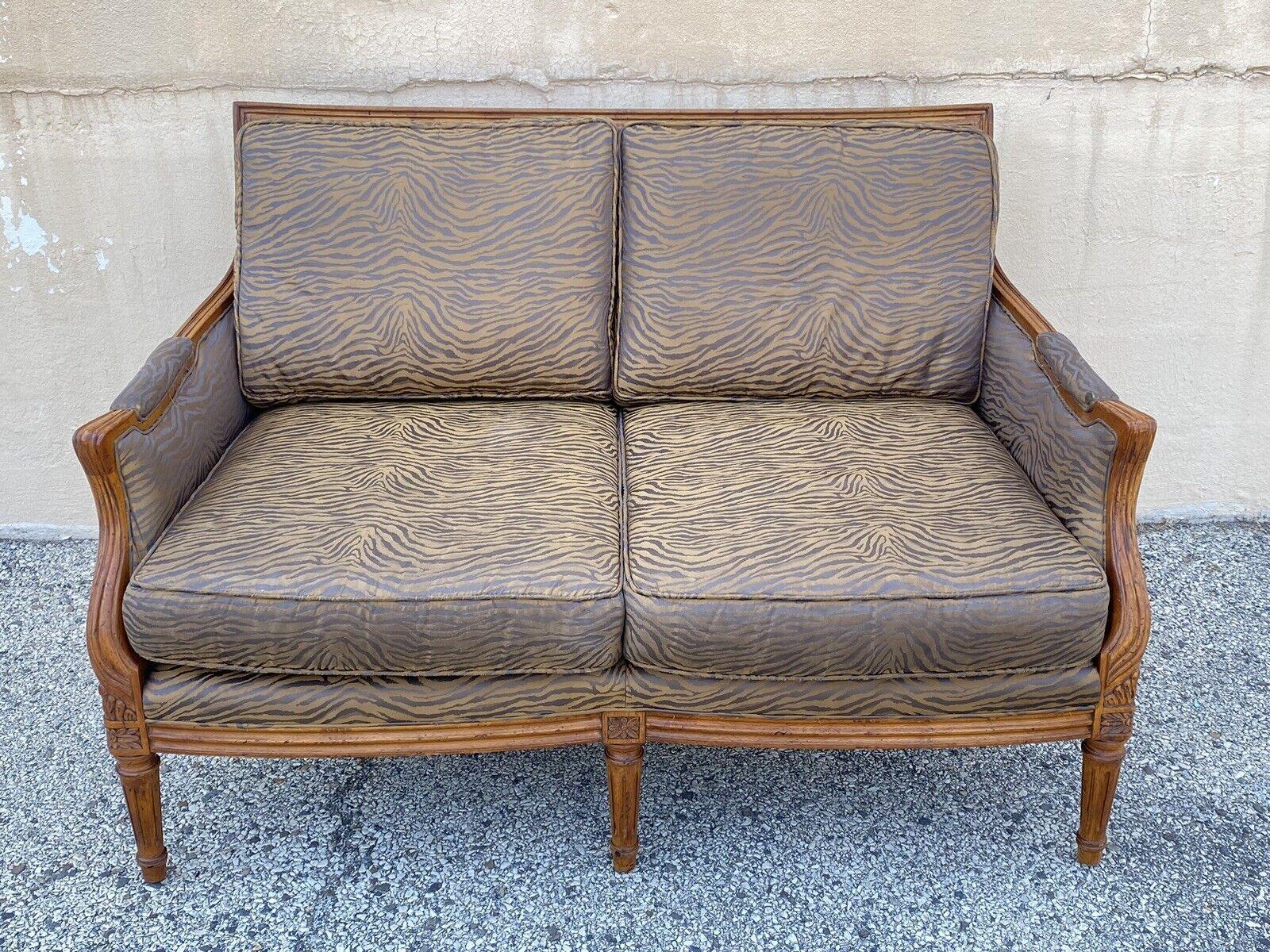 Century Furniture French Louis XVI Style Cane Back Tiger Stripe Settee Loveseat. Item features a solid wood frame, double cane back, nicely carved details, carved tapered legs, unique tiger stripe printed upholstery, original label, quality American