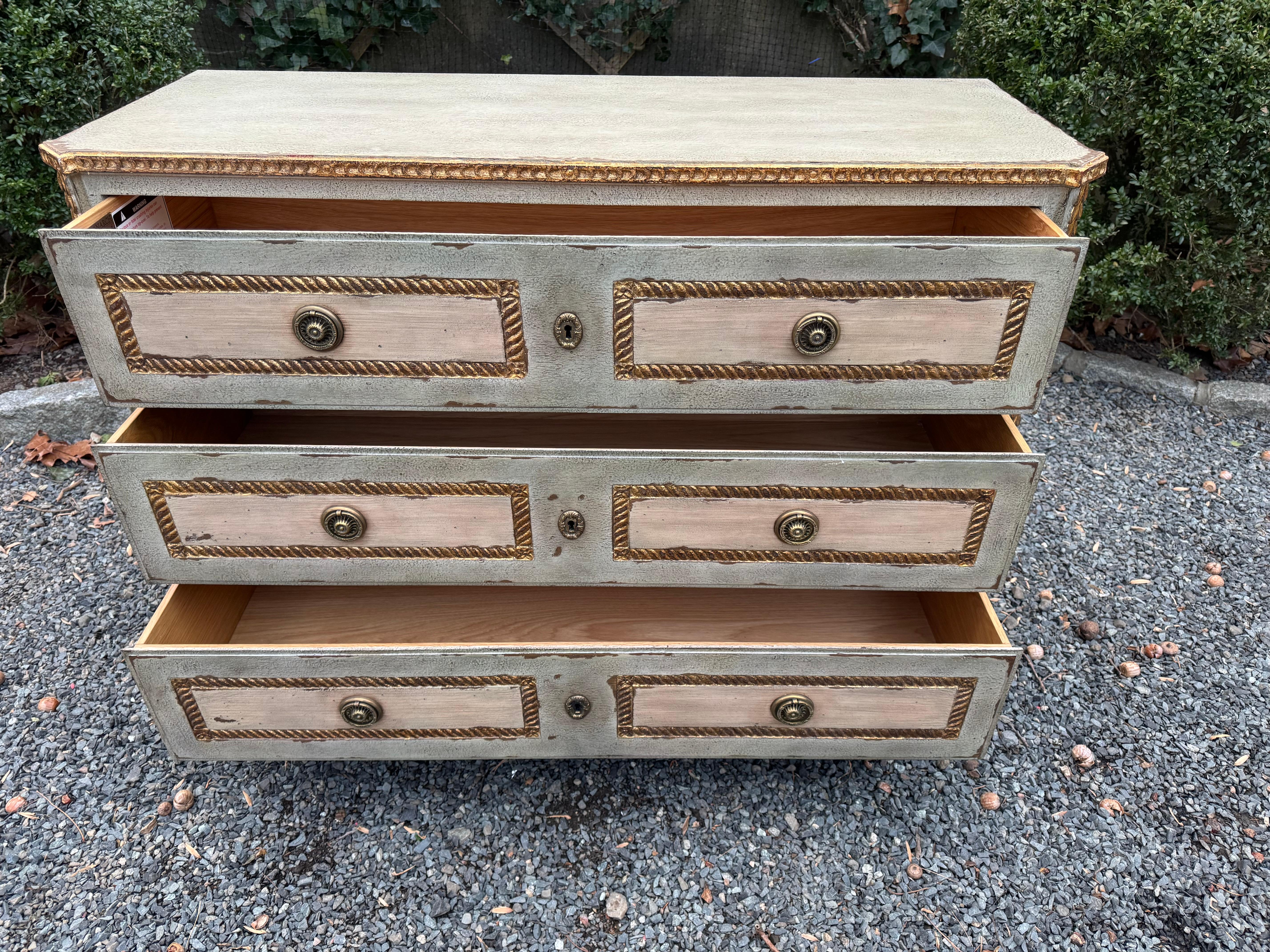 Romantic chest of drawers by Monarch Fine Furniture for Century, the Corbett commode features 3 smoothly working large drawers accented with brass pulls.  The chest is two tone grey and cream painted finish having carved rope and leaf moldings with