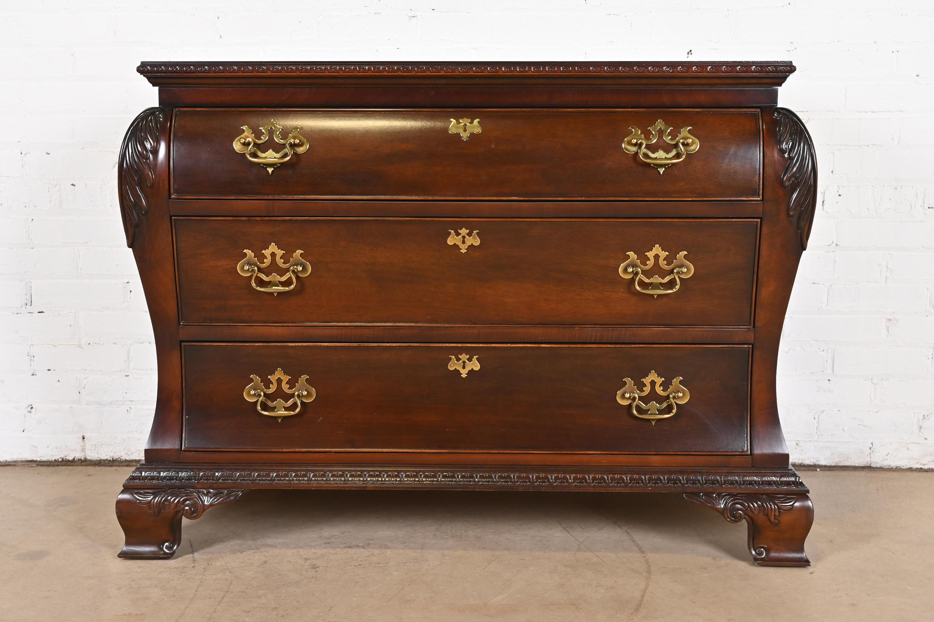 A beautiful Georgian or Chippendale style bombay form dresser, chest of drawers, or commode

By Century Furniture

USA, Late 20th Century

Carved mahogany, with original brass hardware.

Measures: 46.25
