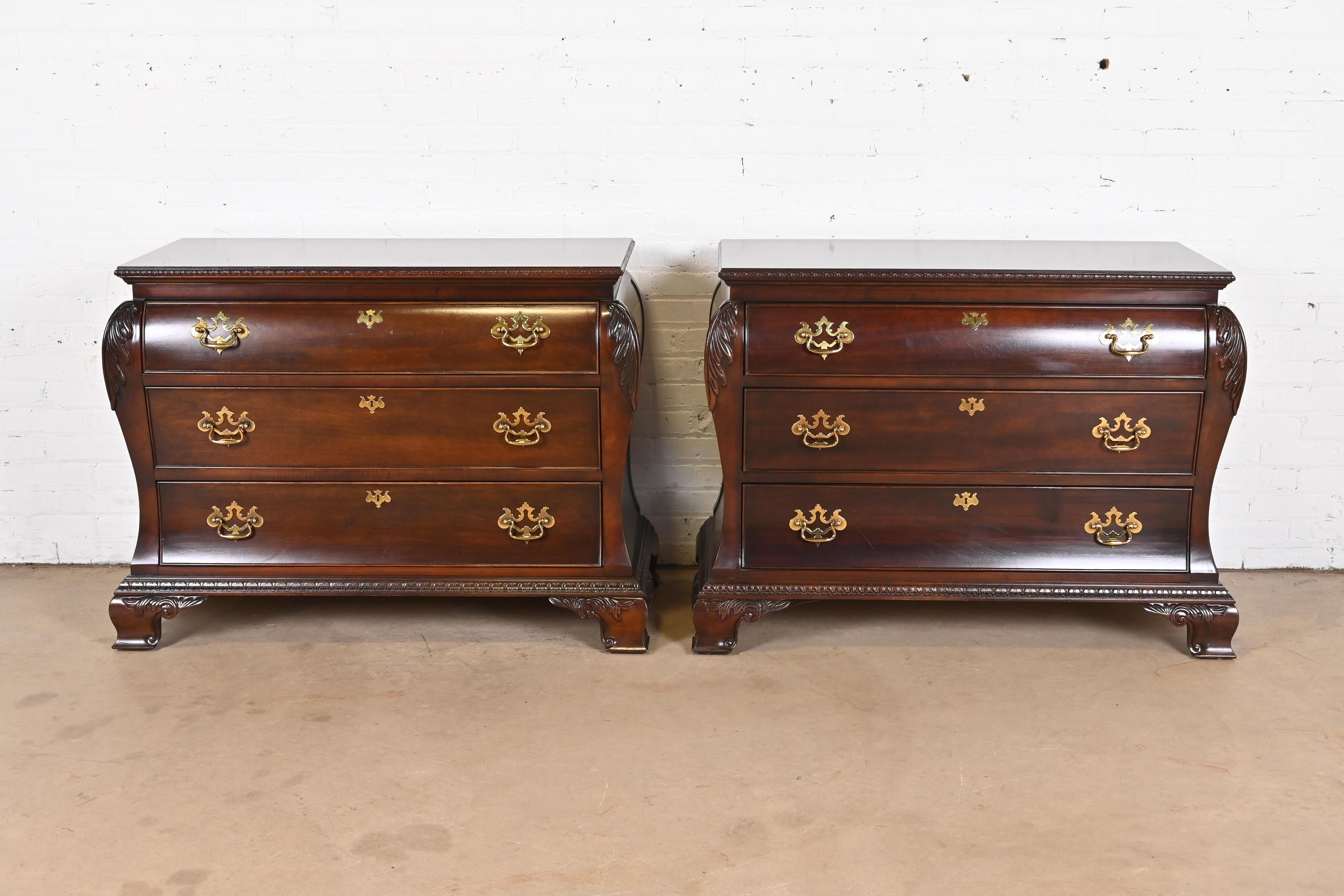 A beautiful pair of Georgian or Chippendale style bombay form dressers, chests of drawers, or commodes

By Century Furniture

USA, Late 20th Century

Carved mahogany, with original brass hardware.

Each measures: 46.25