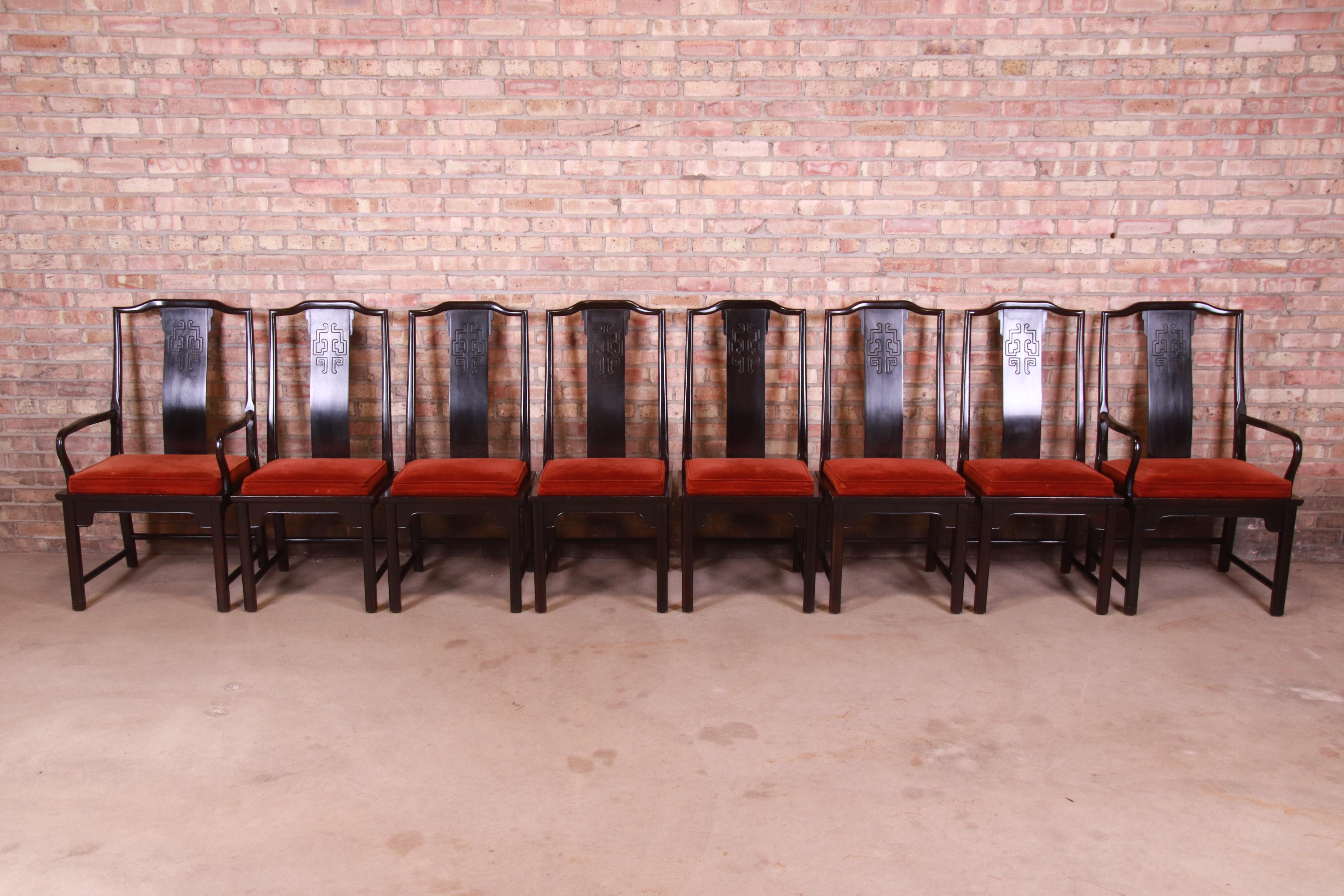 A gorgeous set of eight Mid-Century Modern Hollywood Regency Chinoiserie dining chairs

By Century Furniture

USA, Circa 1970s

Sculpted black lacquered walnut, with carved Asian details and upholstered seats.

Measures:
Side chairs - 19