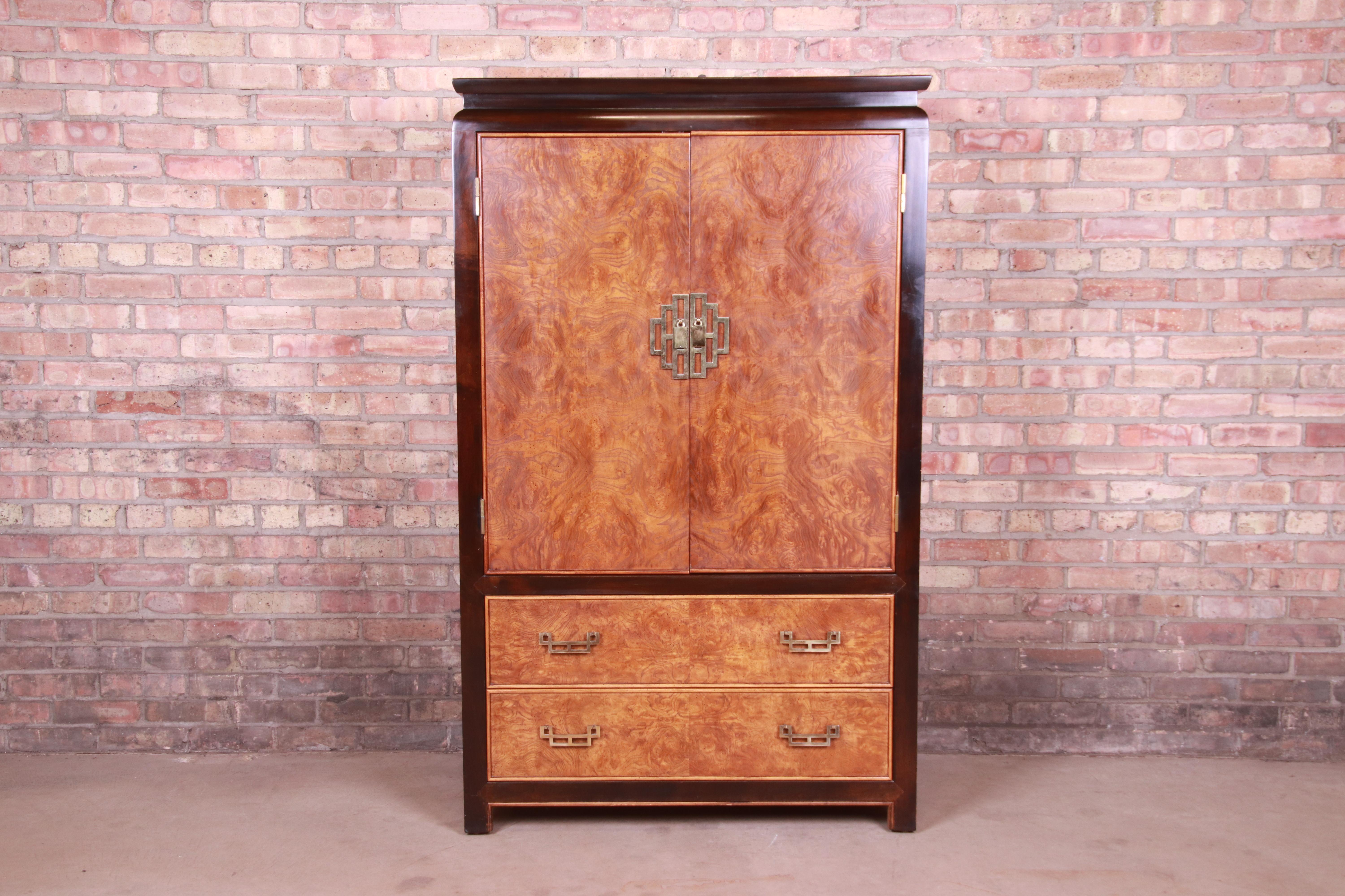 An exceptional Mid-Century Modern Hollywood Regency Chinoiserie gentleman's chest or armoire dresser

By Raymond Sobota for Century Furniture

USA, 1970s

Burl wood, with ebonized trim, and original Asian-inspired brass hardware.

Measures: