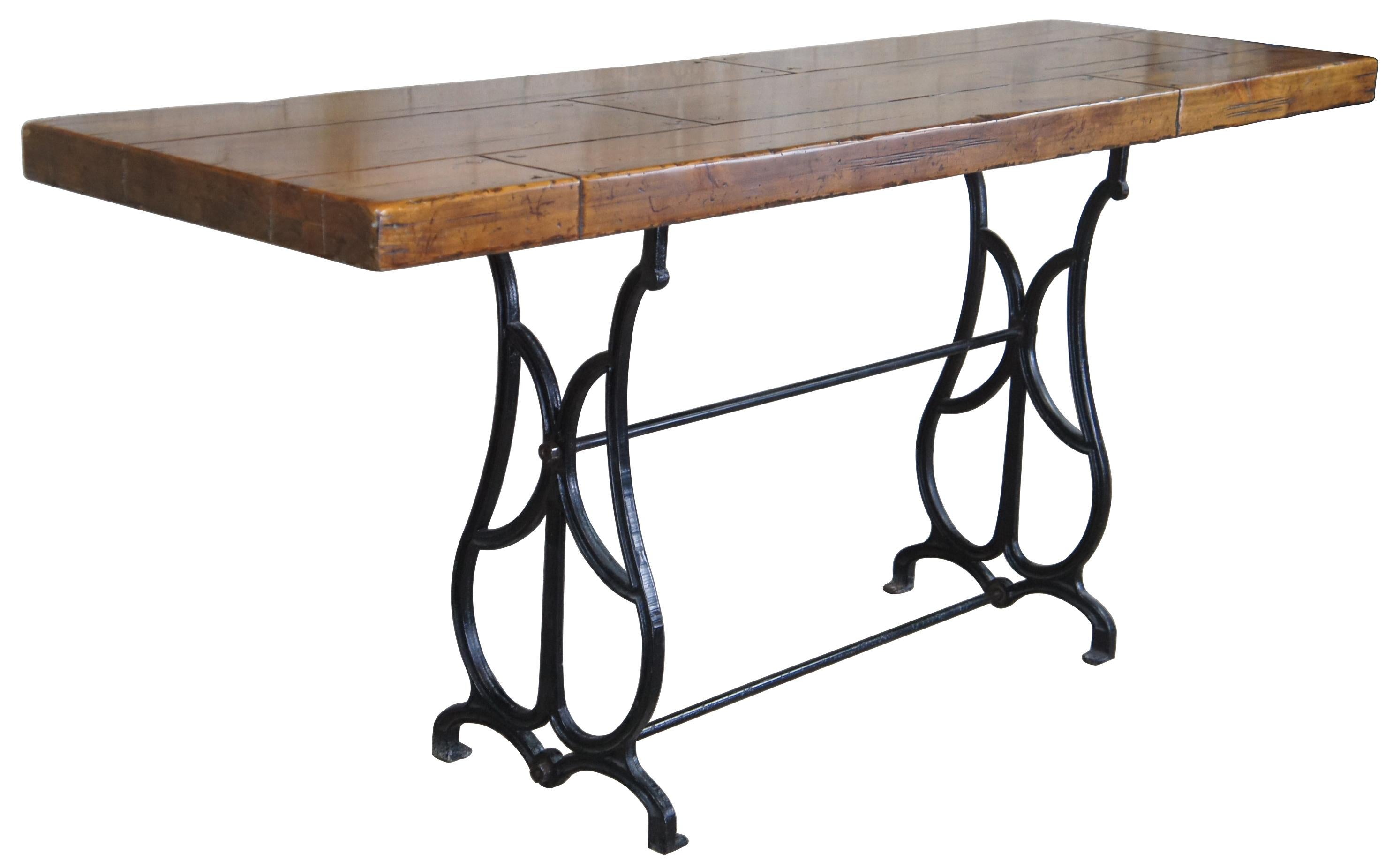 A unique pairing of transitional and antique styling. Features a Century Furniture distressed pine plank top over an antique Iron base. Great for use in an entry console, hallway or sofa table. The top is from 2005 while the base is from the early