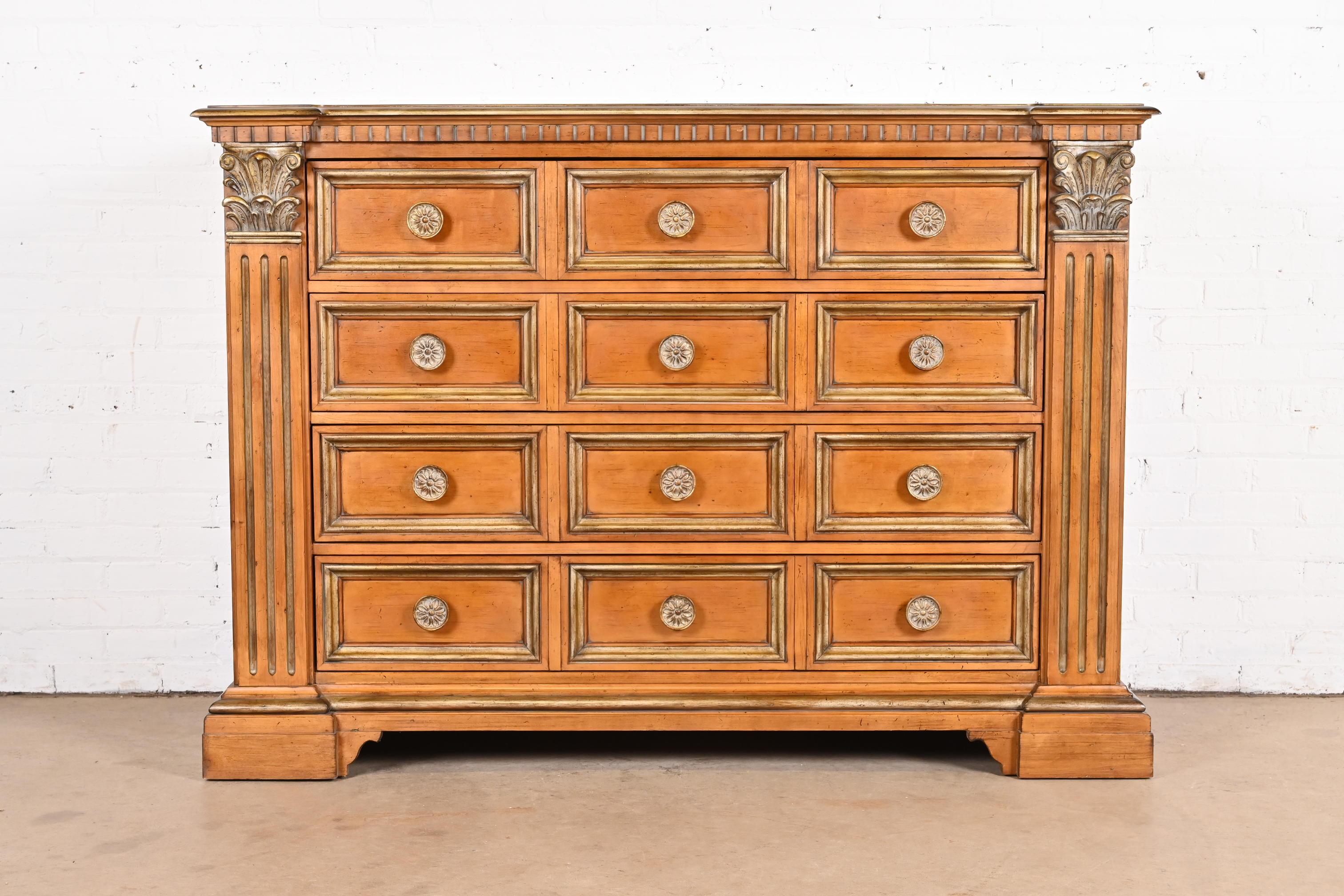 A gorgeous Italian Neoclassical or Empire style four-drawer dresser or chest of drawers

By Century Furniture

USA, Late 20th Century

Beautiful carved maple, with parcel-gilt details, and original brass hardware.

Measures: 62.5