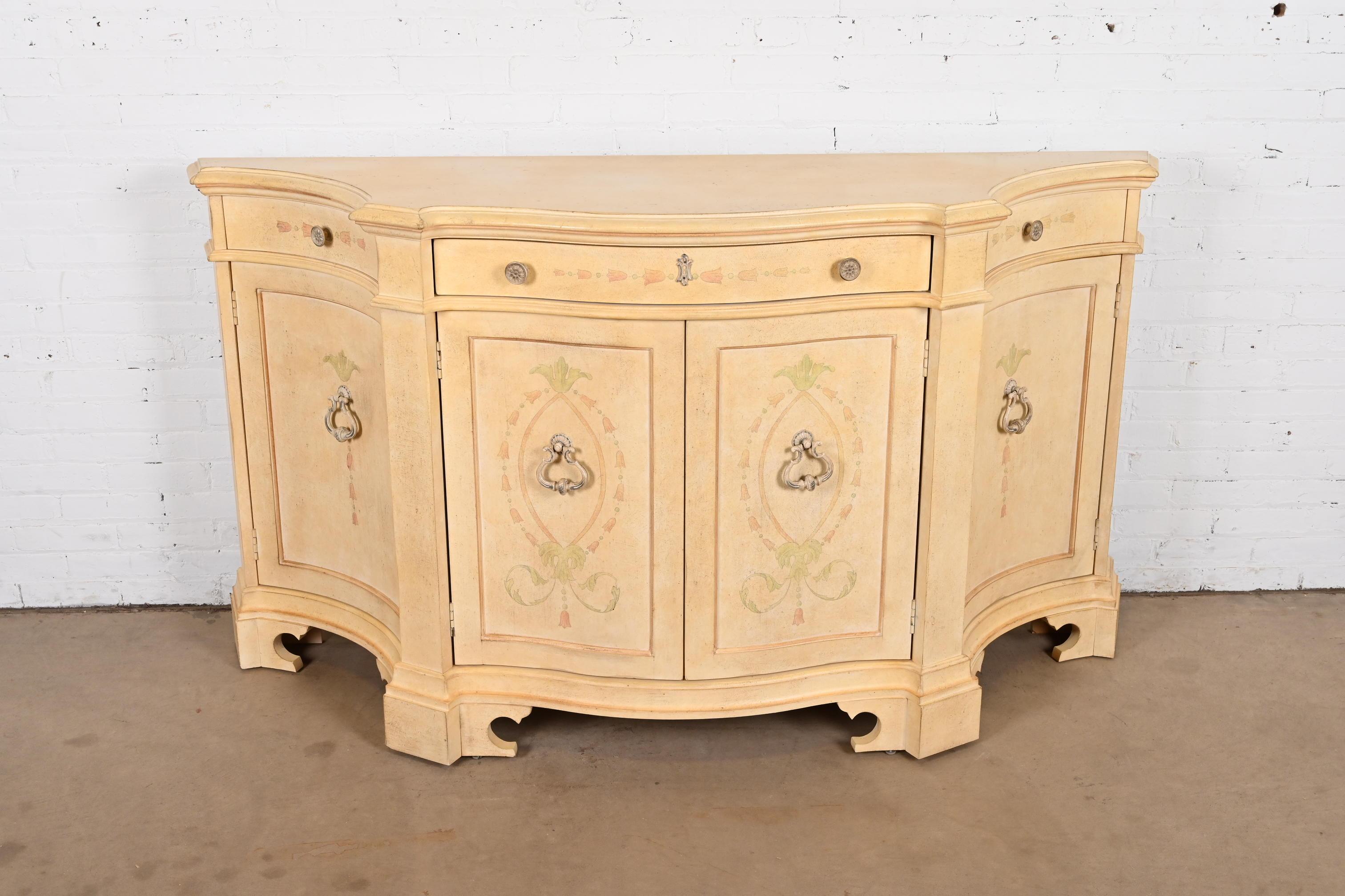 A gorgeous Italian Provincial Venetian style sideboard, credenza, or bar cabinet

By Century Furniture

USA, Circa 1980s

Carved painted walnut, with floral motif, and original hardware.

Measures: 72