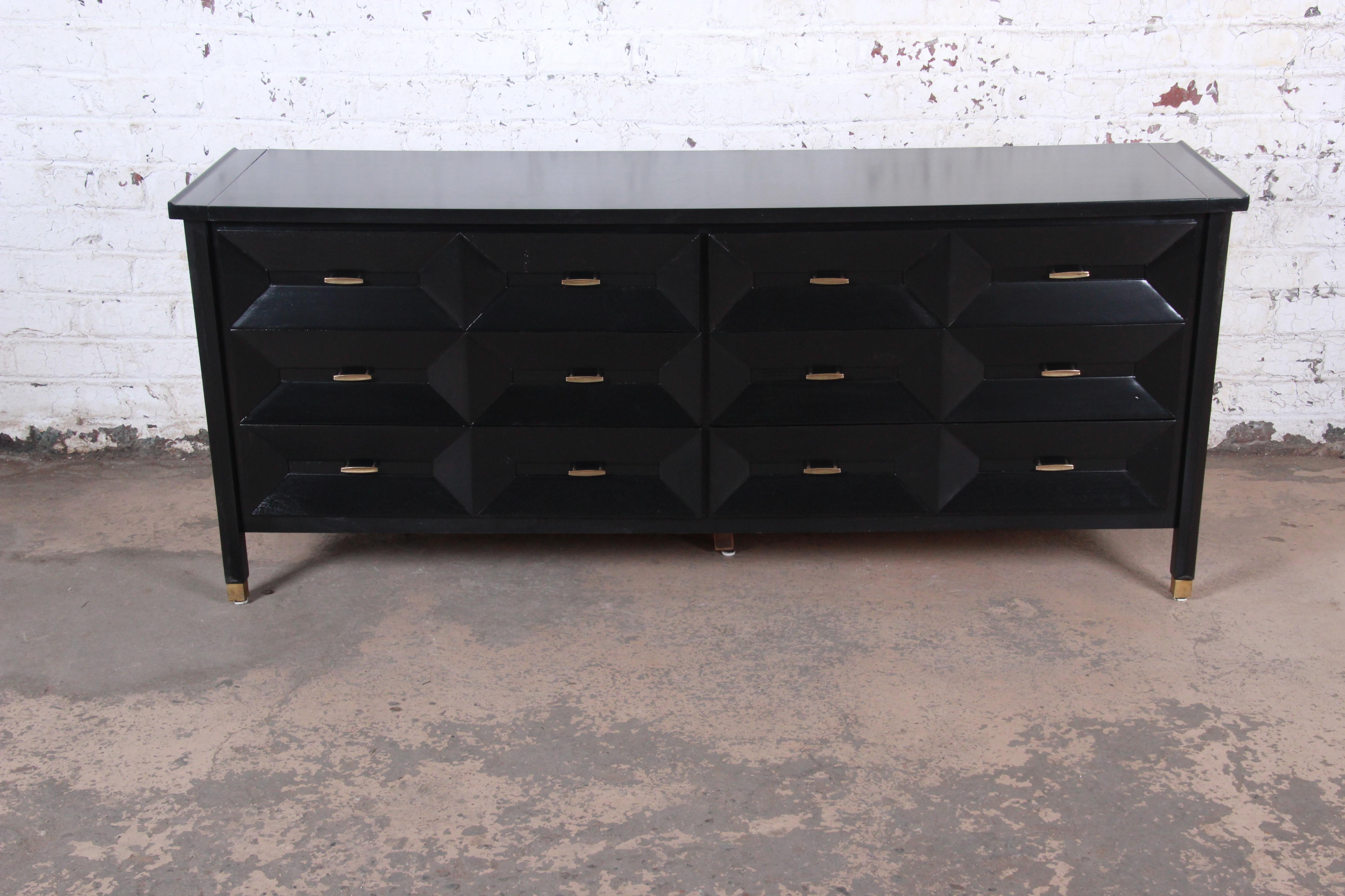 Mid-Century Modern ebonized long dresser or credenza, newly refinished

Made by Century Furniture

USA, circa 1960s

Three dimensional sculpted walnut drawer front and brass hardware

Measures: 75