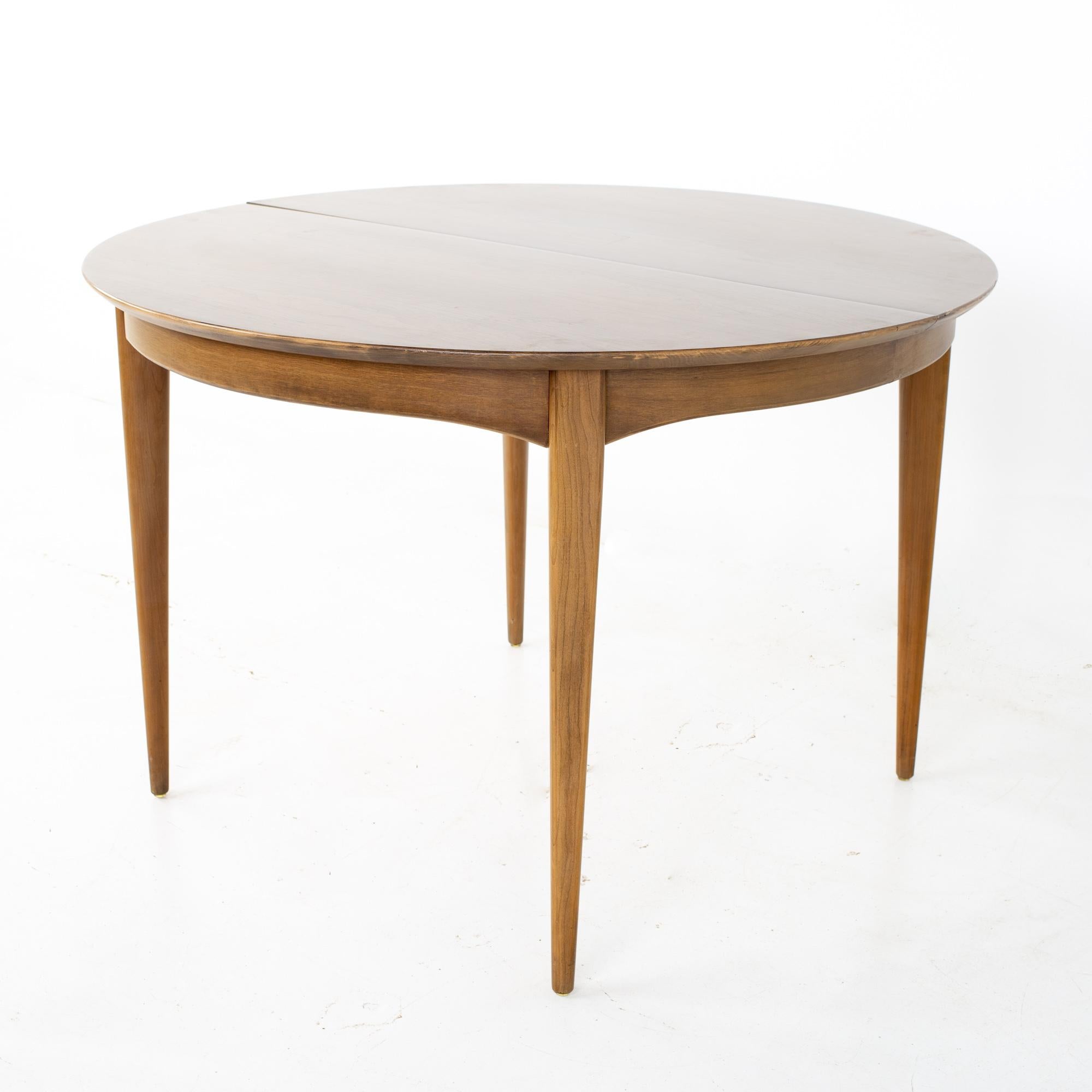 Century Furniture Mid Century round oval expanding walnut dining table
Table measures: 44 wide x 44 deep x 29.25 inches high; each leaf is 12 inches wide, making a maximum table width of 68 inches when both leaves are used 

All pieces of