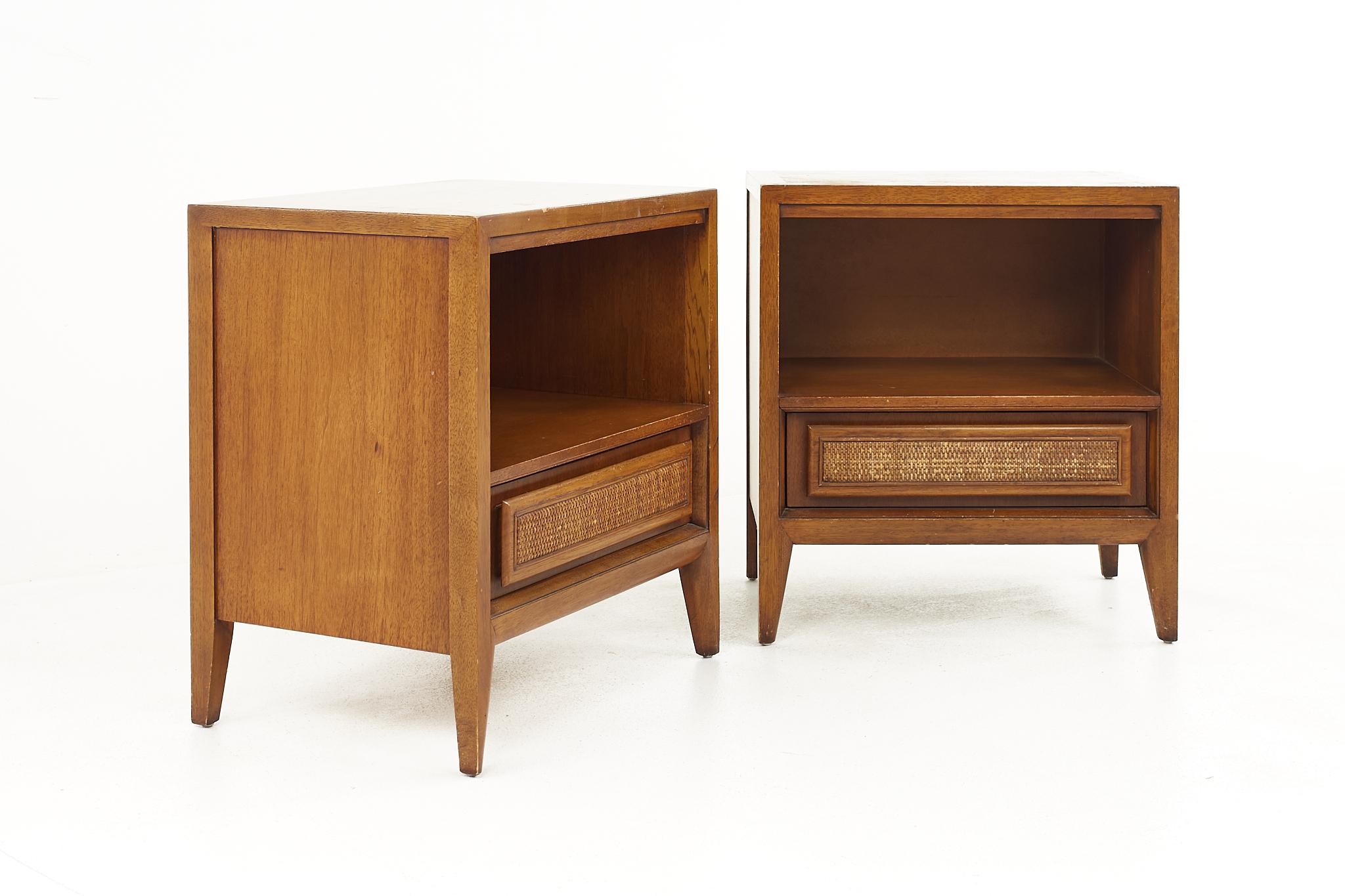 Century Furniture mid century walnut and cane front nightstands - a pair 

Each nightstand measures: 22 wide x 16 deep x 24.25 inches high 

All pieces of furniture can be had in what we call restored vintage condition. That means the piece is