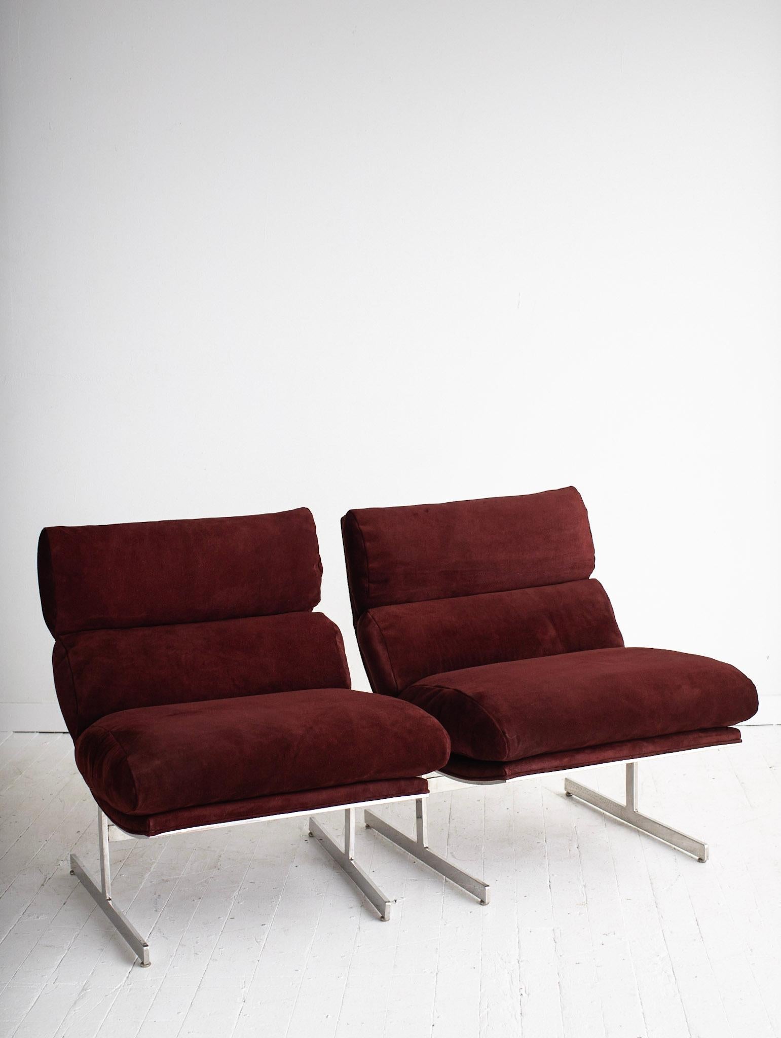 Kipp Stewart for Directional chrome “arc” lounge chair newly reupholstered in burgundy suede. Heavy polished steel cantilever frame. Sold individually. No tags present.