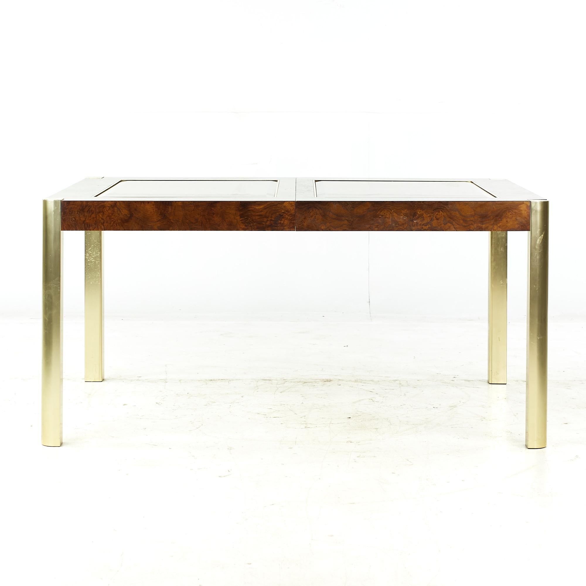 Century mid-century burlwood brass and glass dining table.

This table measures: 60 wide x 40 deep x 29 high, with a chair clearance of 25.5 inches, each leaf measures 18 inches wide, making a maximum table width of 96 inches when both leaves are