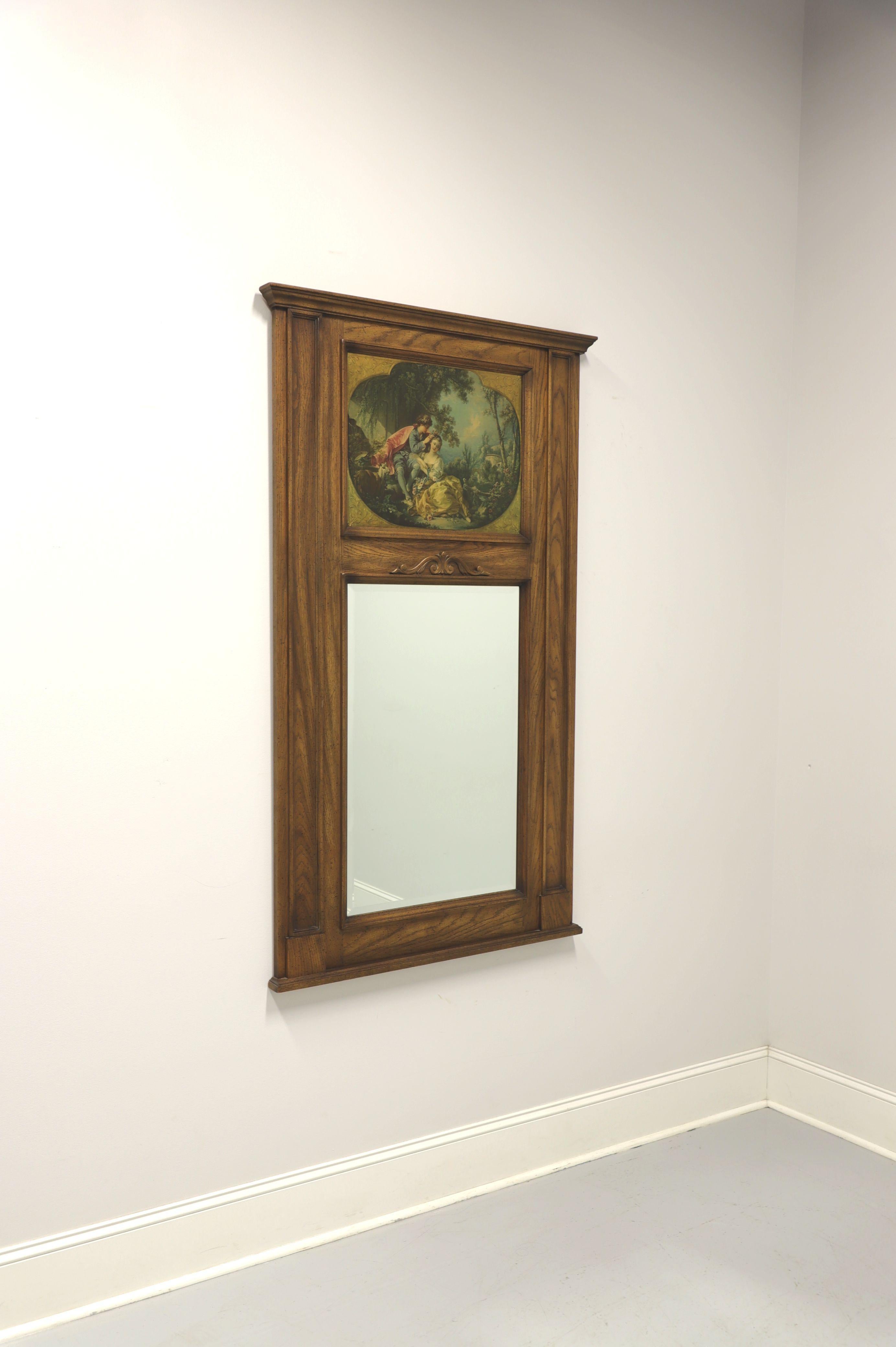 A monumentally sized French Country style Trumeau wall mirror by Century Furniture. Beveled mirror glass in a tall solid oak frame with decoratively painted panel depicting children in a garden above the mirror. Made in the USA, in the late 20th