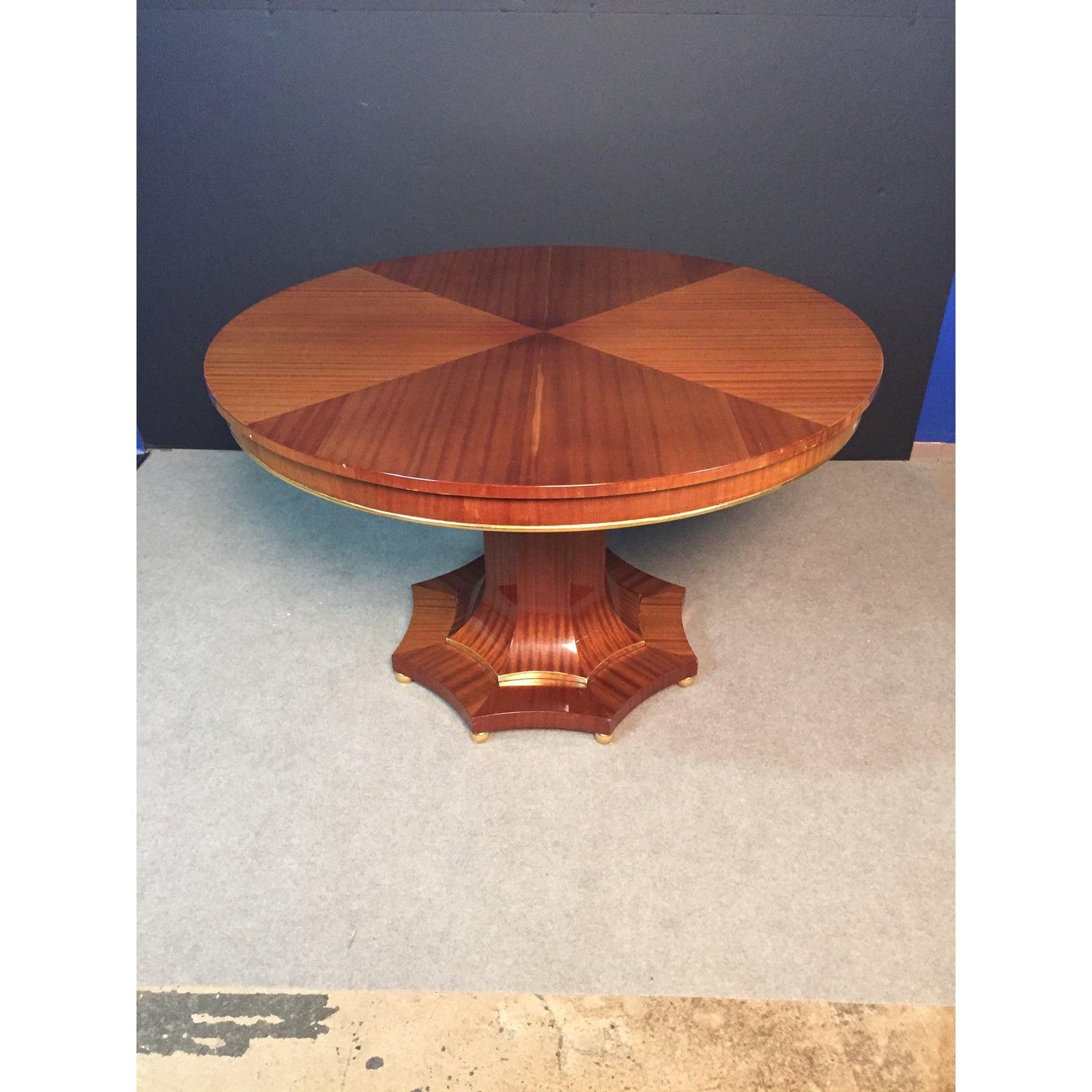 Regency style light golden mahogany center table, with a Biedermeier influence. Gilt accents. Can also be used as a dining table.