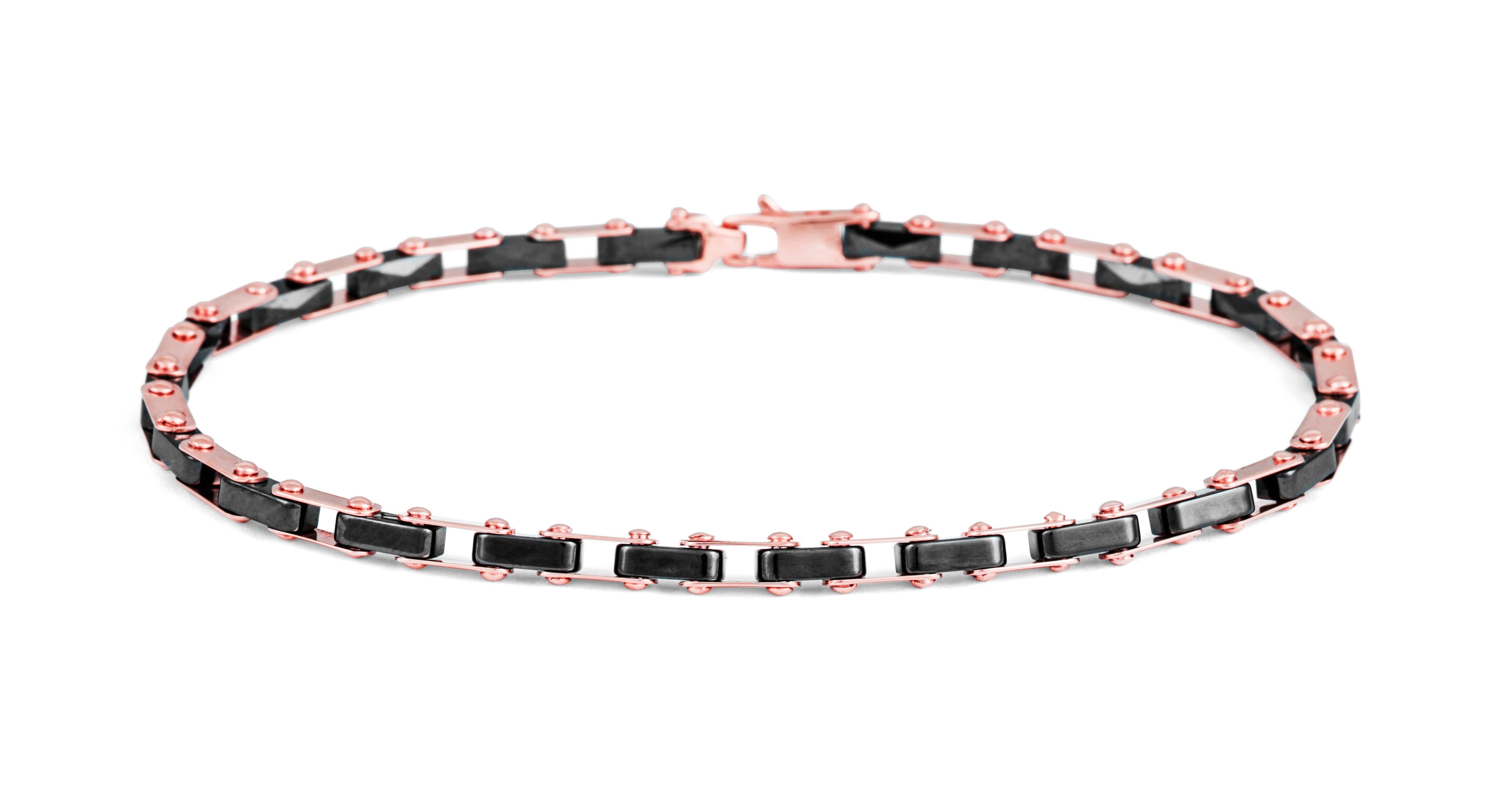 Intricately carved, black, faceted pieces of ceramic have been skillfully connected with polished 18K rose gold to create an articulating tennis style bracelet. The small square lobster clasp blends in with the links to create a flowing and stylish