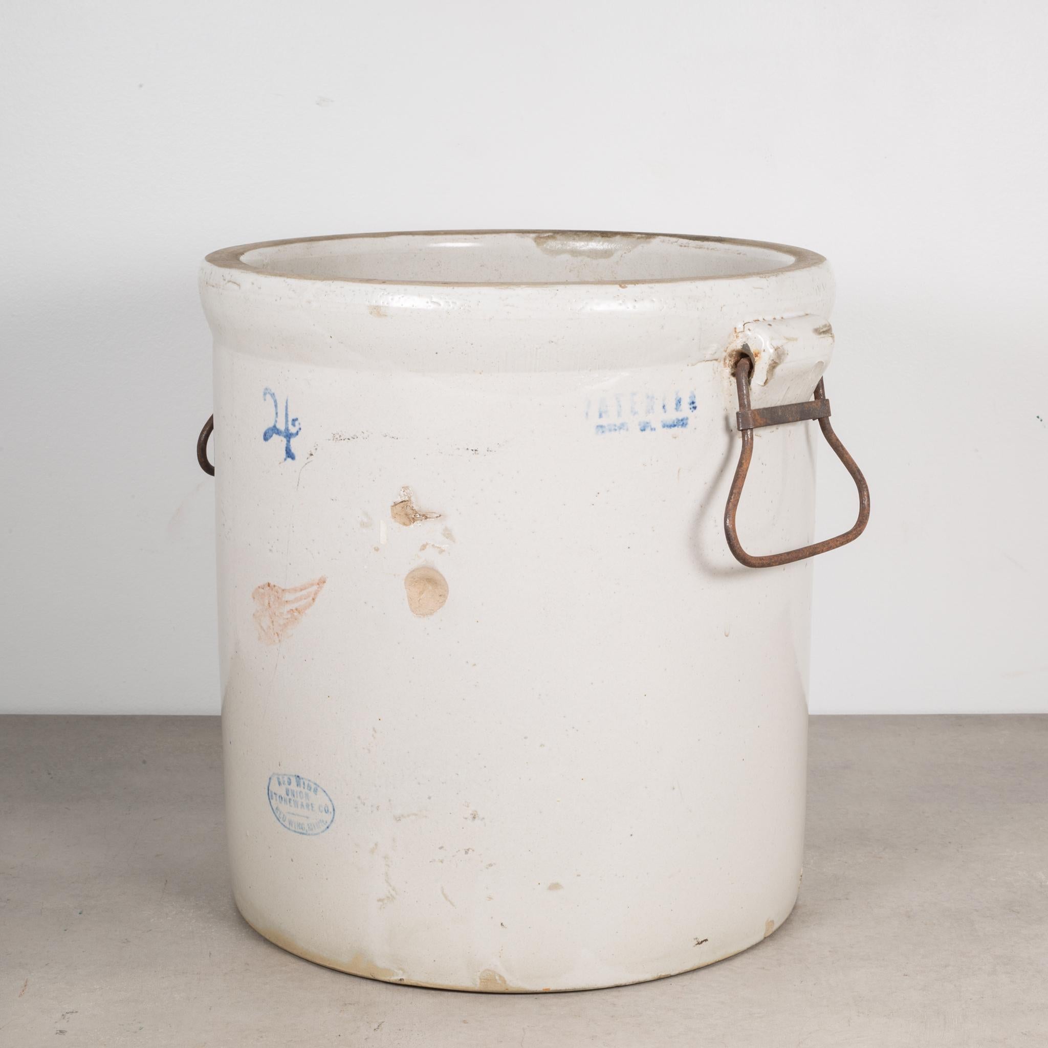 About

This is an original commercial 4 gallon crock with ceramic wrapped metal handles manufactured by the Red Wing Union Stoneware Company, Minnesota USA. The piece has retained its original finish and is in excellent condition with appropriate