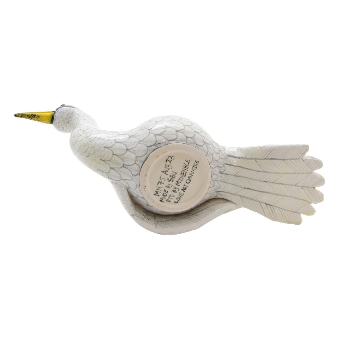 Crafted by the skilled hands of Sbusiso and painted with intricate detail by Minenhle at Love Art Ceramic in South Africa, this Bird jewelry box measures 6 inches high, 3 inches long, and 9 inches wide. Representing the vibrant avian life of Africa,