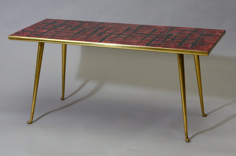 A 1950s French ceramic topped coffee table signed C. De Savigny.