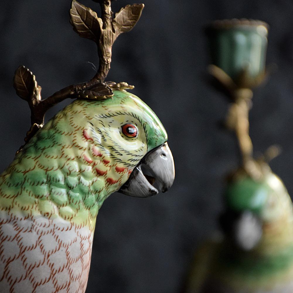 Ceramic and brass parrot candle sticks 

A charming and ornate matched pair of late 19th Century parrot form candle sticks with brass detail and hand painted floral, insects at the base. Stamped LW 1895 Royal crest.

Size in inches: H 14” x W 4”