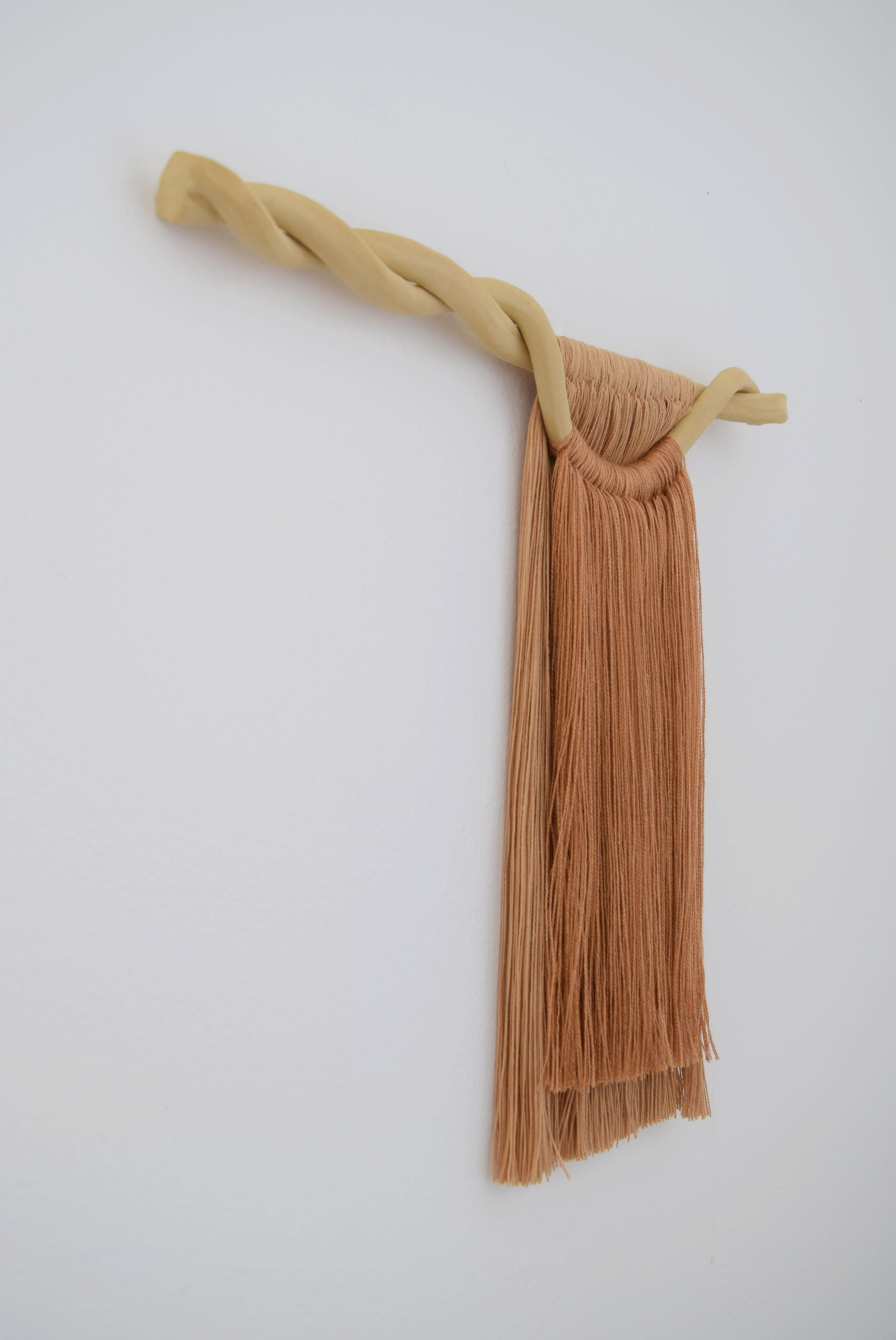 Wall sculpture #677 by Karen Gayle Tinney

Mixed material wall sculpture comprised of a ceramic panel with applied cotton and tencel fringe. The ceramic piece is hand formed out of stoneware and is left unglazed. Fringe has been hand applied and