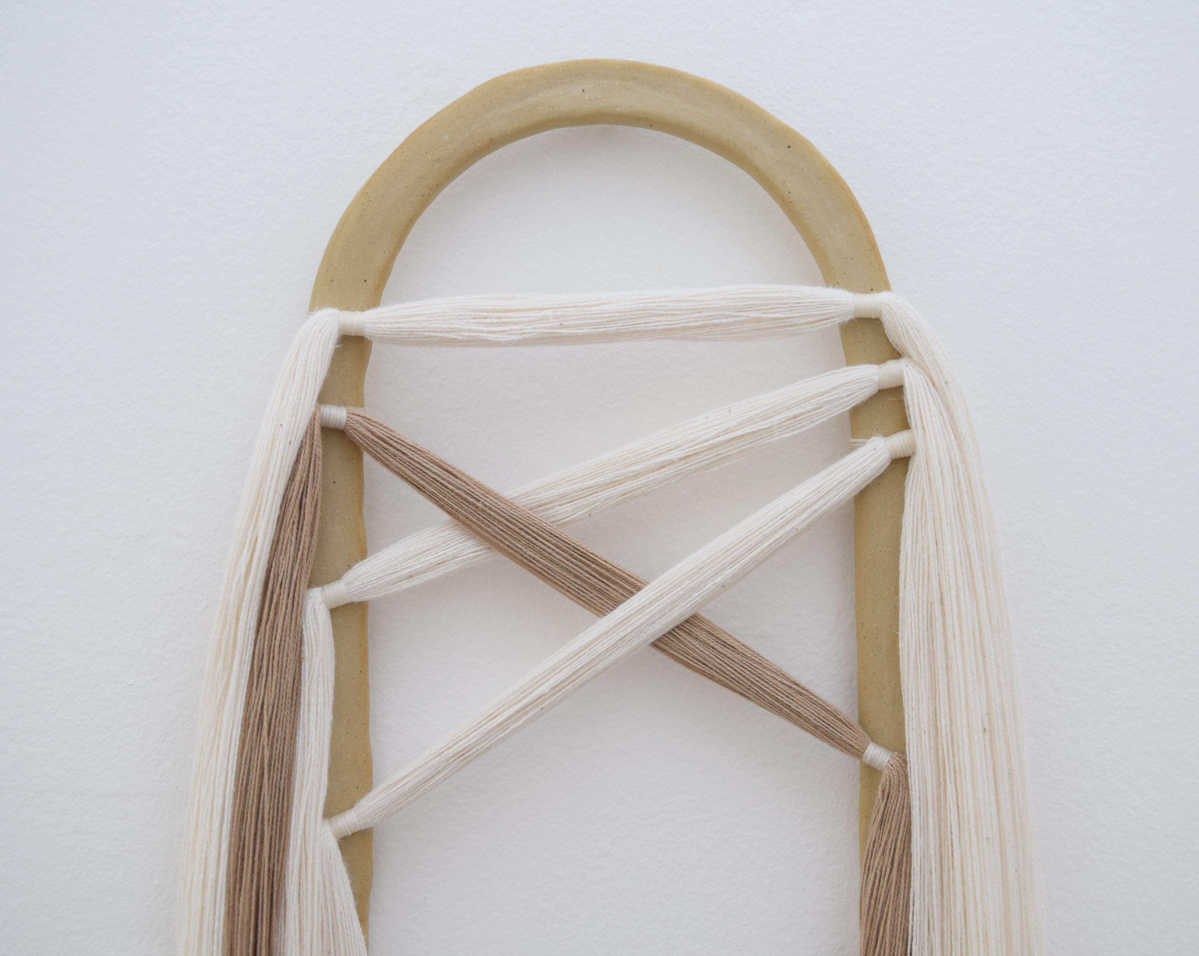 Wall sculpture #649 by Karen Gayle Tinney

Mixed material wall sculpture comprised of a ceramic panel with applied cotton fringe. The ceramic piece is hand formed out of stoneware and is left unglazed. Fringe has been hand applied to the ceramic