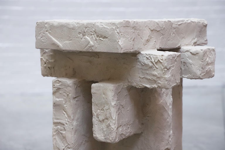 Using ceramic and a kind of white gypsum cement called Hydrocal, the sand spackle side table by Hayden Richer is an investigation into the convergence of sculpture and furniture, focusing on ideas of the building, growth, weathering, and