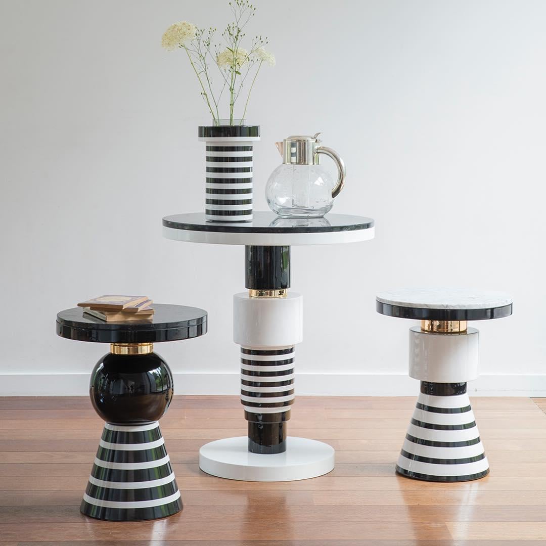 Materials: Ceramic, marble, wood, aluminium
Dimensions: H 45 cm Ø 35 cm
Marble top: Nero Marquina/Arabescato Carrara
Custom piece: Gold/ silver/ copper/ black/ white


Eric Willemart overthrows design codes with its evolutive system