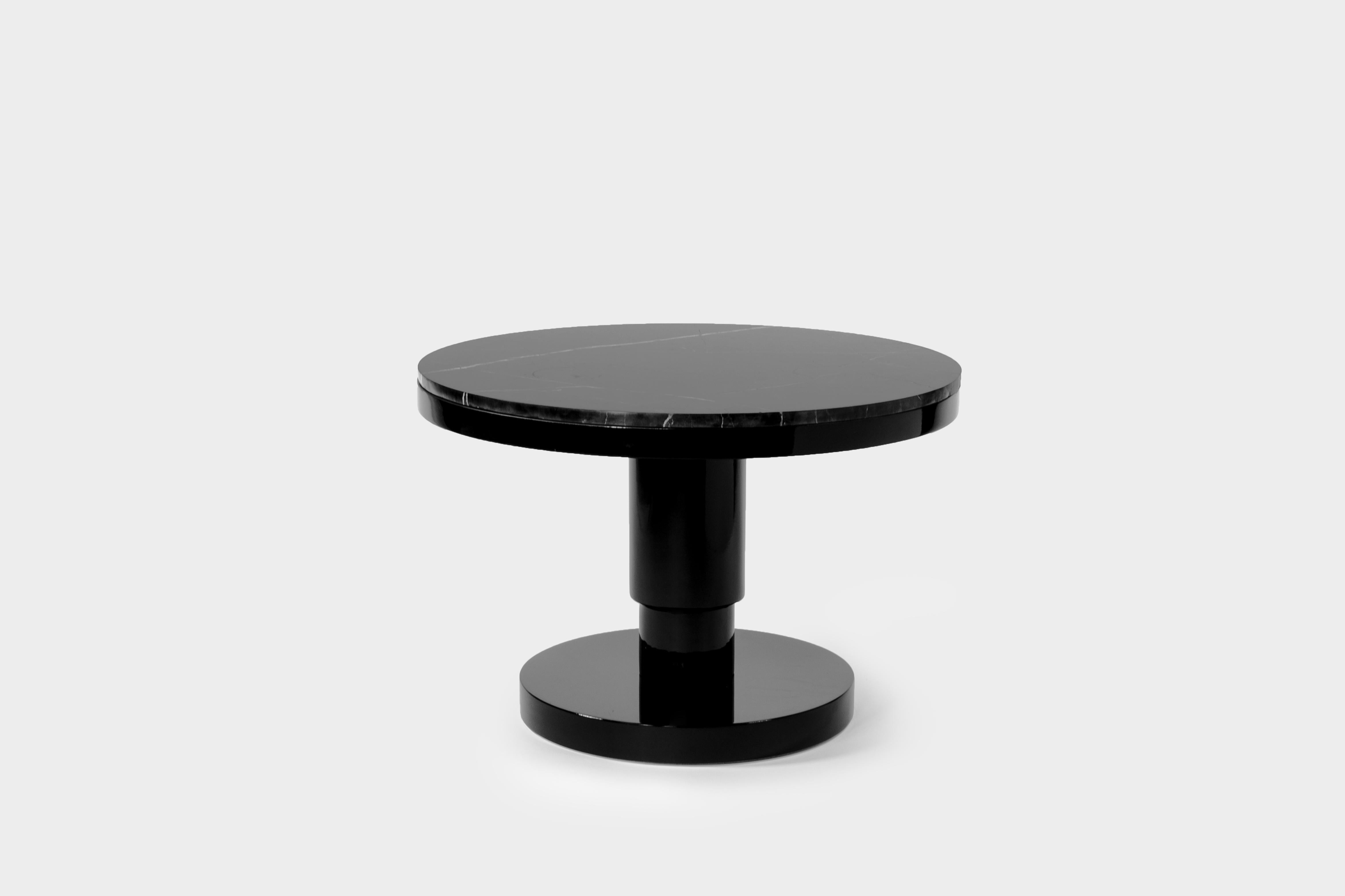 Ceramic and marble coffee table by Eric Willemart
Materials: Top: Polished Nero Marquina marble plate embedded in a
 black lacquered wooden tray
 Body: Handcrafted ceramic glazed in black
 Base: Black lacquered wood on an aluminium