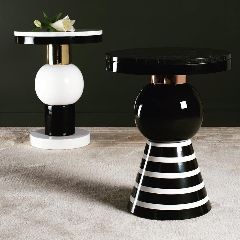 Materials: Ceramic, marble, wood, aluminum
Dimensions: H 45 cm Ø 35 cm
Marble top: Nero Marquina/Arabescato Carrara
Custom piece: Gold/silver/copper/black/white

Eric Willemart overthrows design codes with its evaluative system composed
of