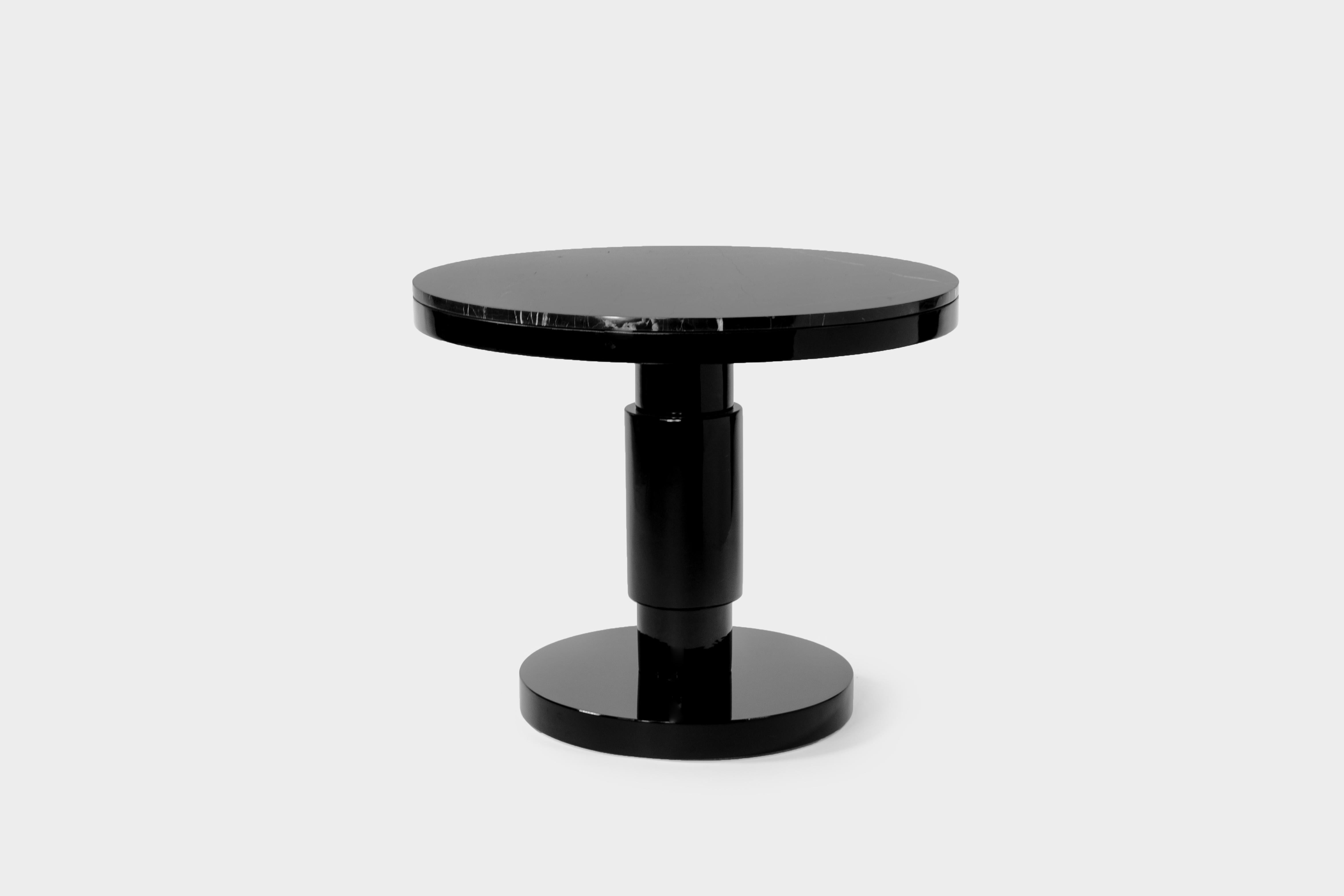 Ceramic and marble large coffee table by Eric Willemart
Materials: Top: Polished Nero Marquina marble plate embedded in a
black lacquered wooden tray
Body: Handcrafted ceramic glazed in black
Base: Black lacquered wood on an aluminum