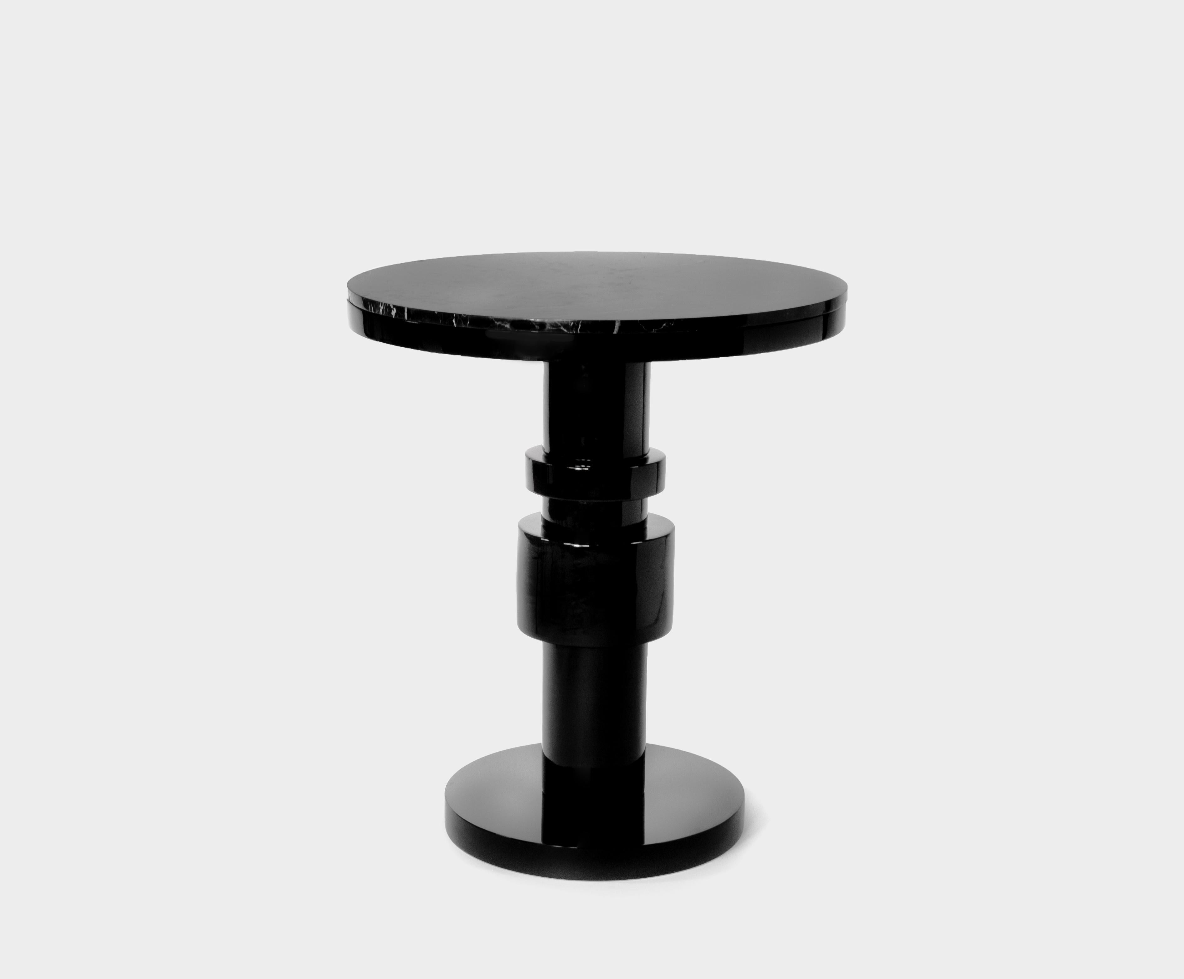 Ceramic and marble pedestal table by Eric Willemart
Materials: top: Polished Nero Marquina marble plate embedded in a
 black lacquered wooden tray
 Body: Handcrafted ceramic glazed in black
 Base: Black lacquered wood on an aluminium