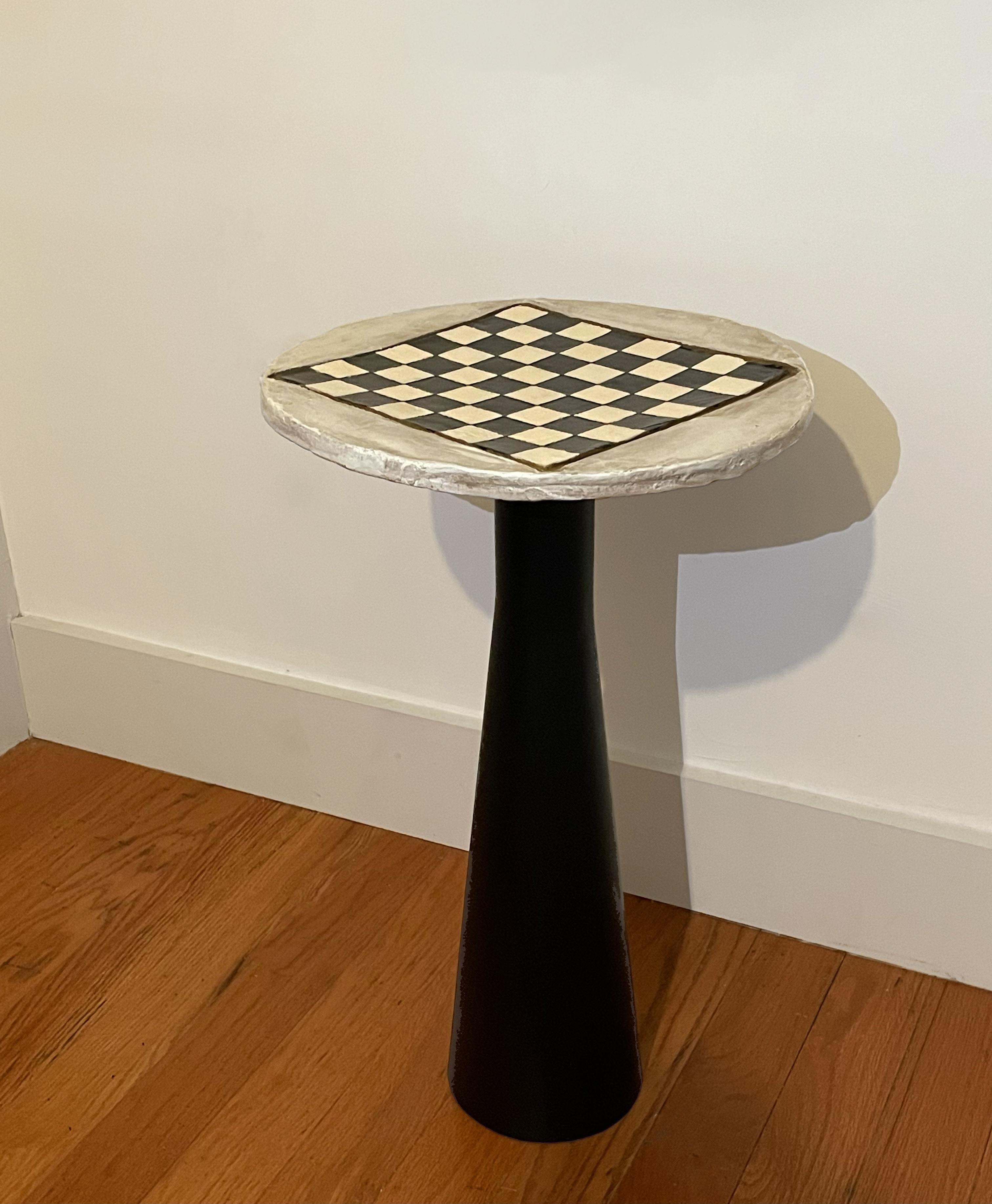 Whether you're a chess enthusiast or appreciate handmade craftsmanship, this table is a timeless addition to any space. Display it proudly and make every game a stylish affair, or use it for a decorative accent. 

The tabletop is a hand crafted