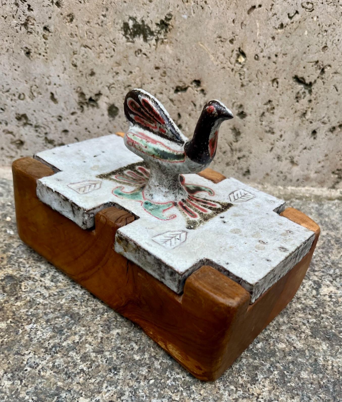 Rare box by Jean Derval 
ceramic lid with bird shaped handle, olive wood box.
One of a kind.
By Jean Derval. ( 1925/2010 )
 Vallauris circa 160's
In 1947, Jean Derval joined Robert Picault and Roger Capron in Vallauris were they shared a workshop.