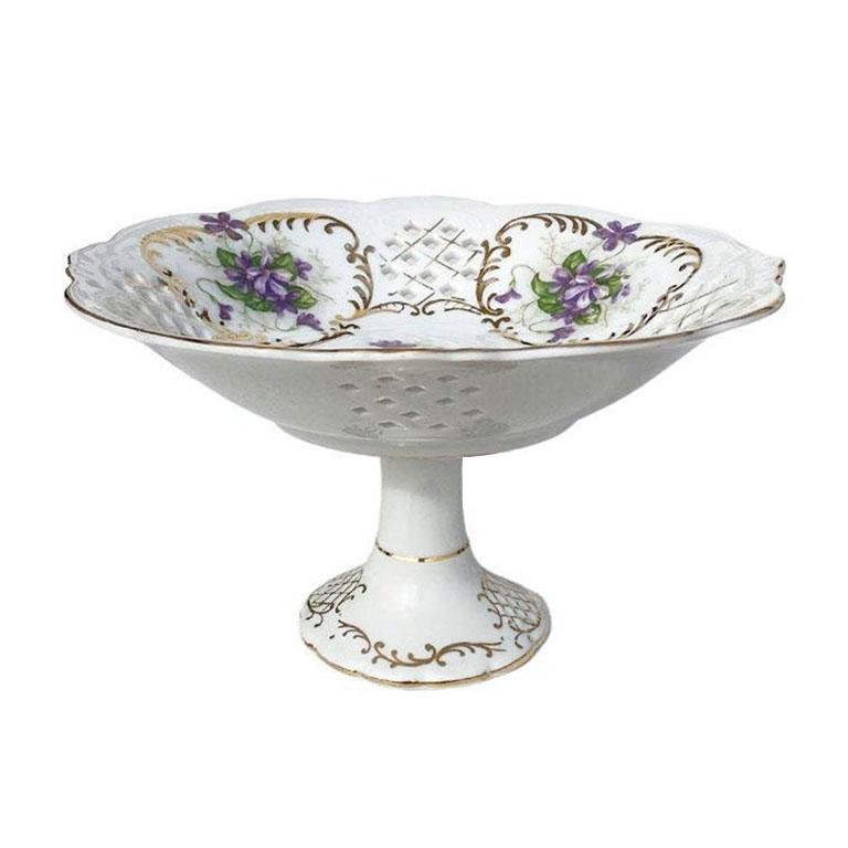Rare Lenwild hand painted three graces compote by Ardalt. Created in occupied Japan, this rare piece could be used as a candy dish, trinket dish, or compote. Sitting upon a gilt ceramic pedestal, a round dish with scalloped edges sits on top. Purple