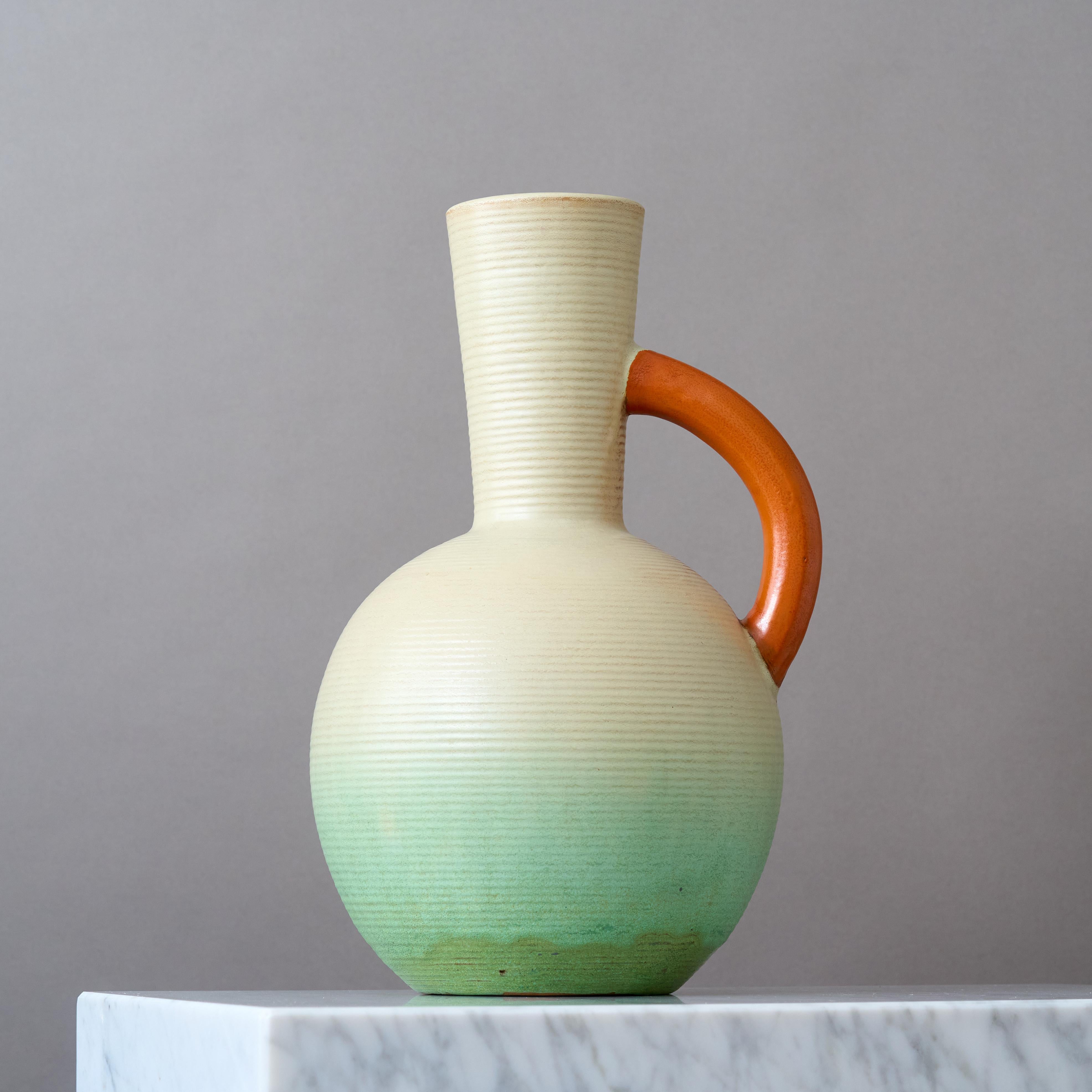A large and impressiv Art Deco earthenware floor vase with amazing glaze.
Made by Andersson & Johansson in Höganäs, Sweden, 1930s.

Impressed with makers mark.
Great condition, no chips, cracks or crazing.

Andersson & Johansson, later known as