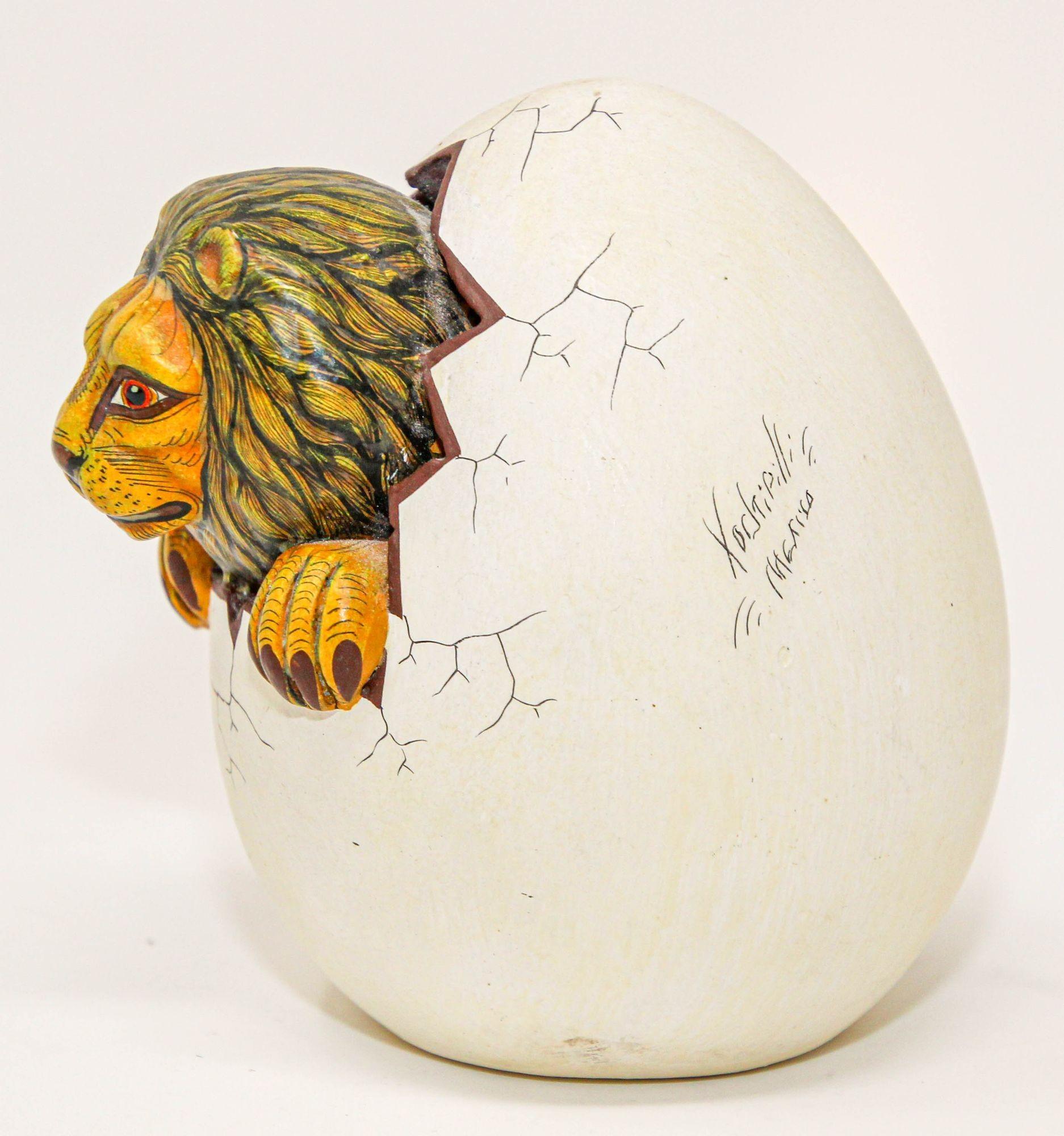 Small ceramic art sculpture with a lion in egg hatching.
Small realistic lion hatching egg sculpture.
It is clay base ceramic and hand painted in vibrant colors, realistic and intricate high quality and detailed designs on the lion. 
There are