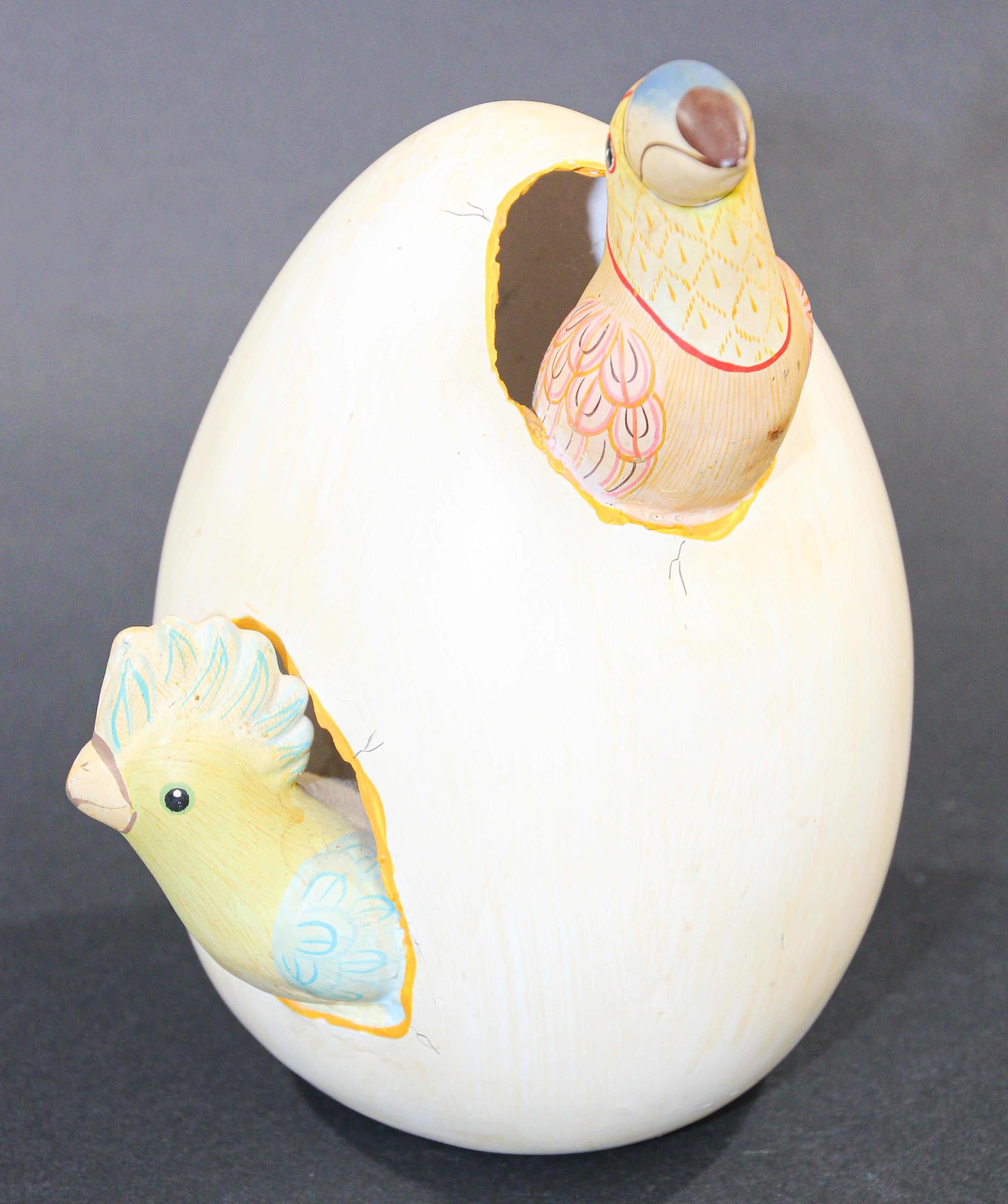 Large ceramic art sculpture toucans in egg hatching Signed by Artist.
Mexican Tonala Folk Art Hatching Egg with two Toucan Parrot Birds. 
Ceramic Sculpture Parrots, Toucans in Egg depicting 2 colorful toucan birds breaking free from an egg. Signed