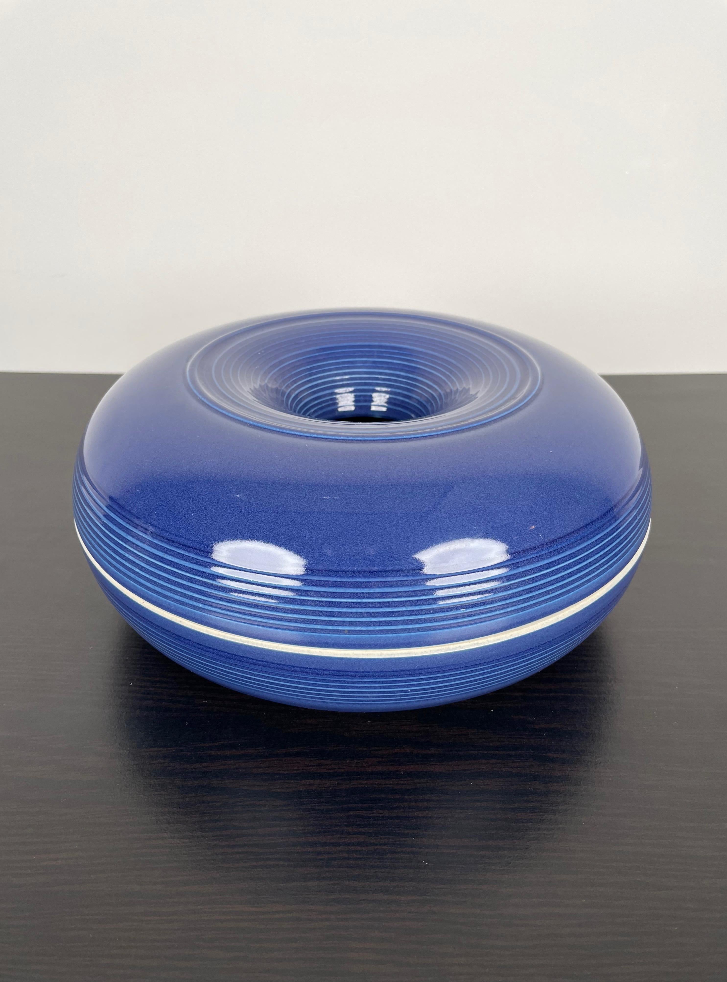 Blue violet ceramic ashtray made in Italy in the 1970s by the Italian designer Franco Bucci for Laboratorio Pesaro. 
The original label is still attached on the bottom of the ashtray.