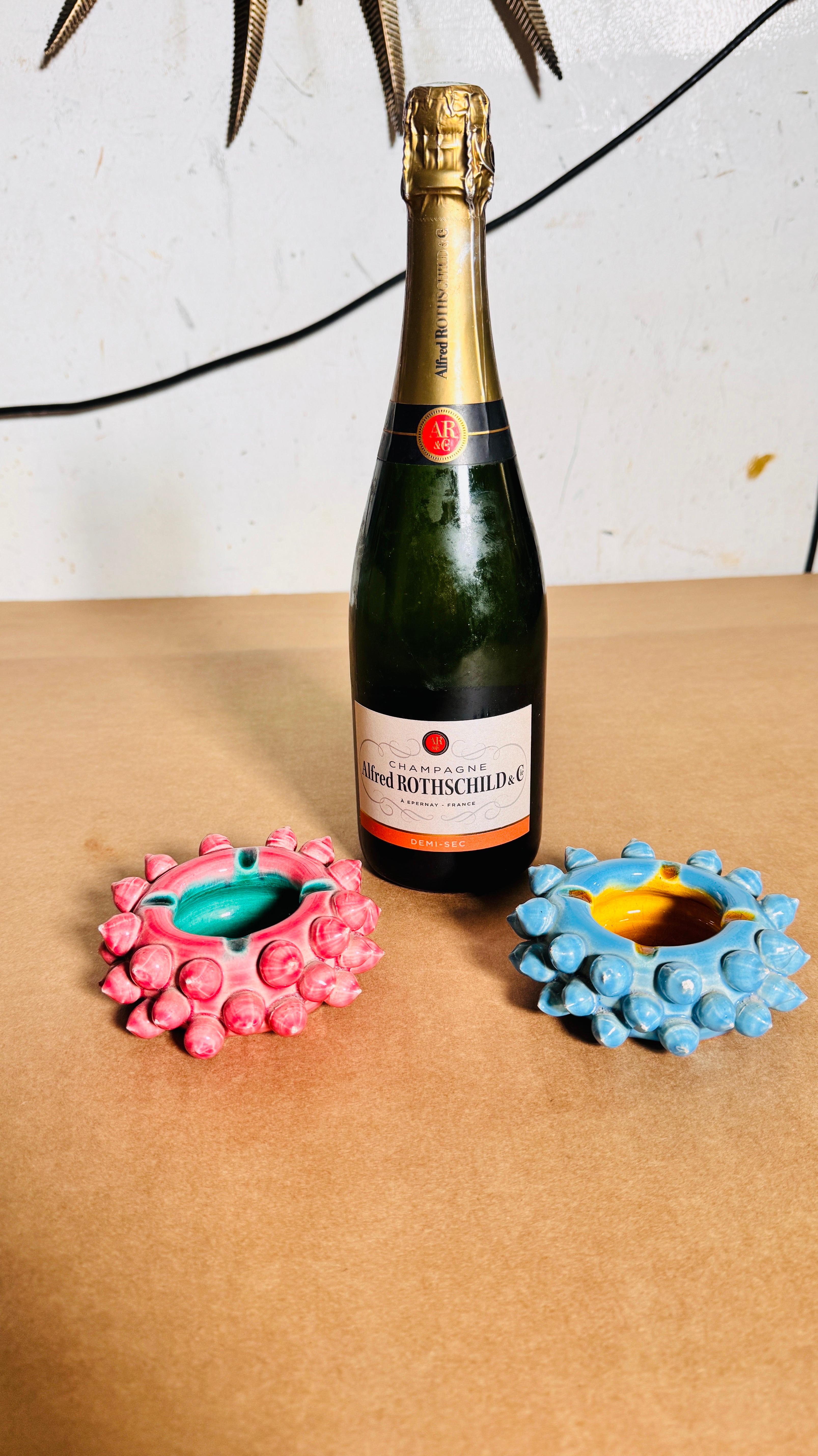 Pair of Ceramic Ashtrays with Sea Urchin Motif, Pink and Blue, Decorative and Functional

This pair of ceramic ashtrays, designed with a striking sea urchin motif, combines artistry and functionality. Featuring one in pink and the other in blue,