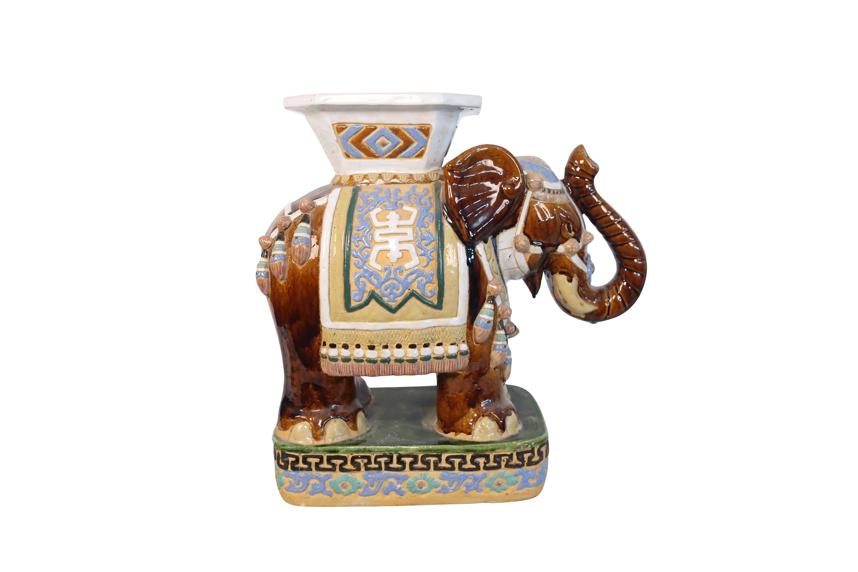 white ceramic elephant stool