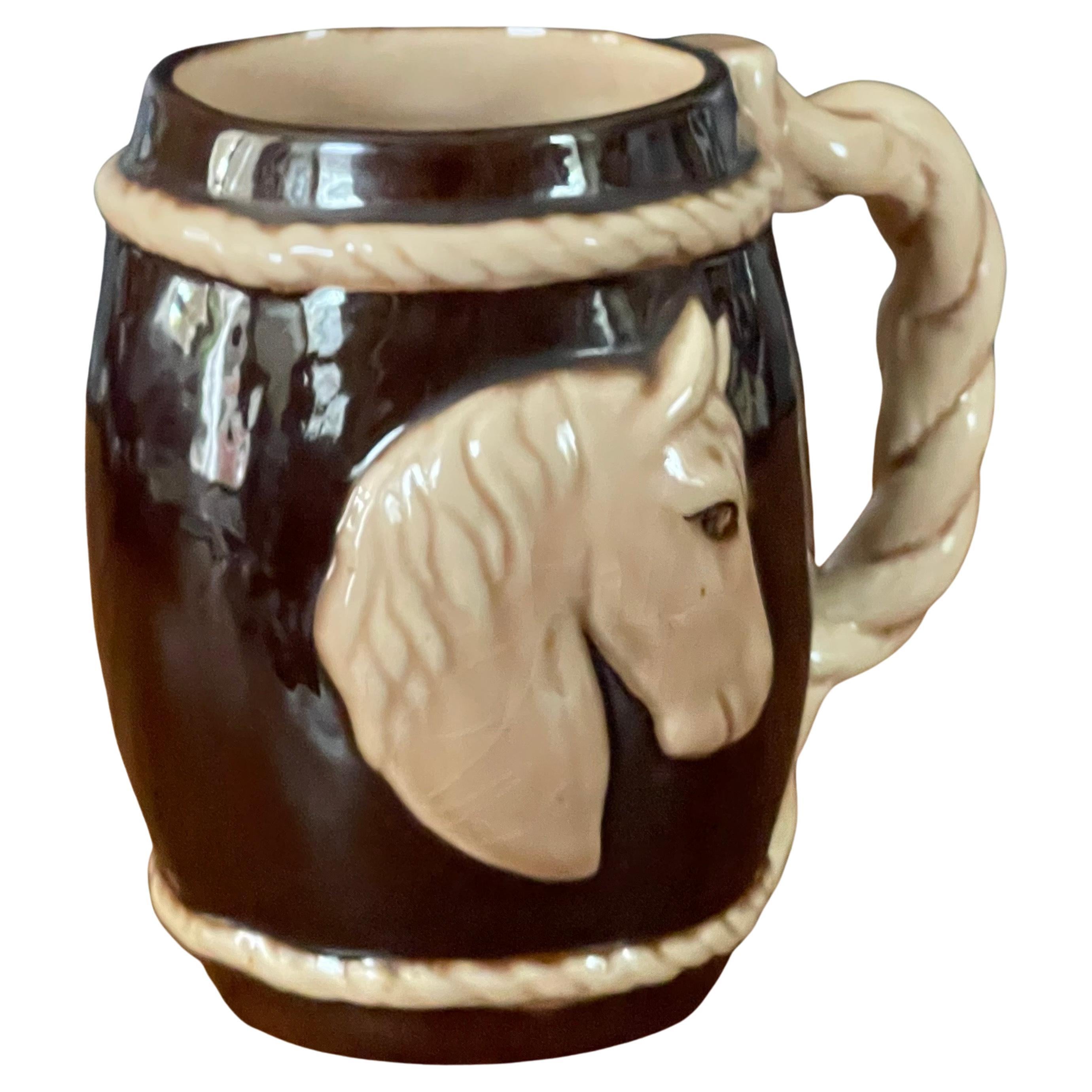 A fun ceramic barware horse mug by Dorothy Kindell, circa 1940s. This hard to find piece is in good vintage condition (some crazing is present) and measures 4.5