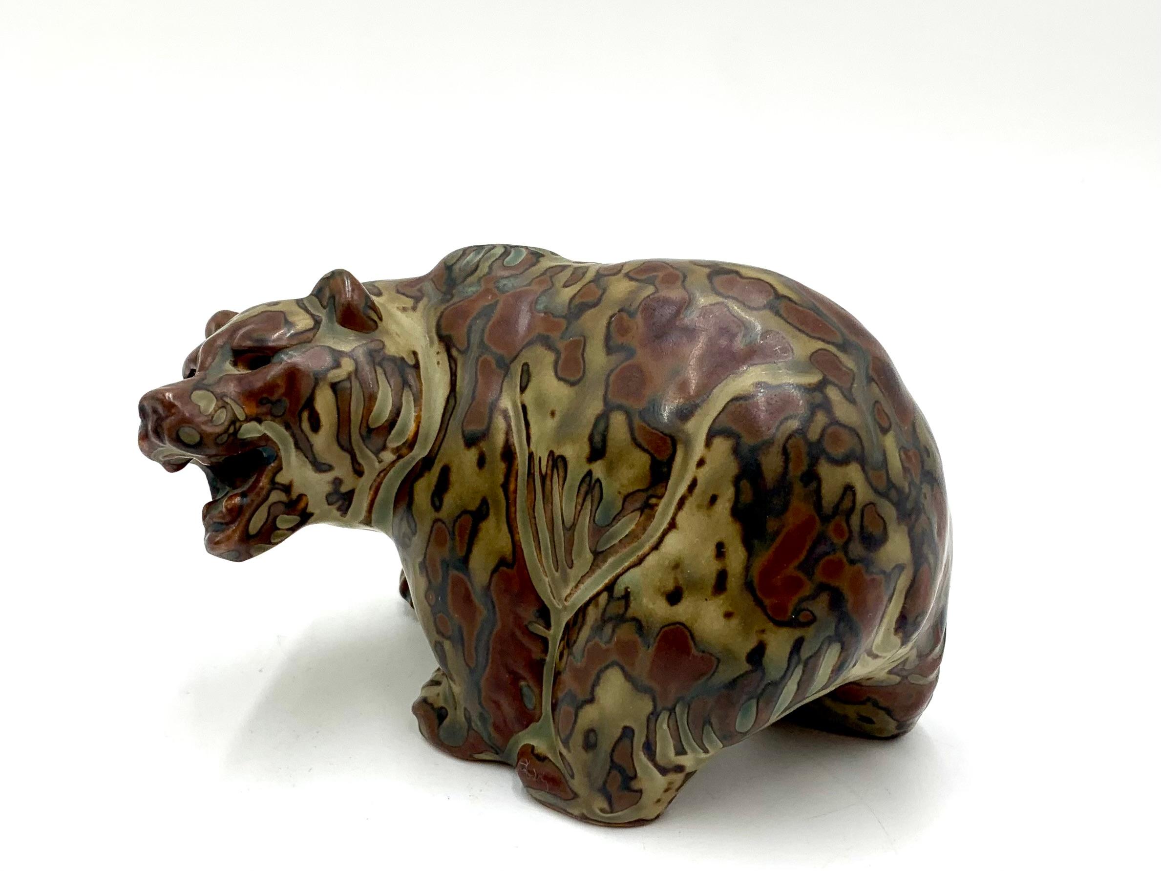 Ceramic bear figurine by Knud Kyhn, produced by the Danish Royal Copenhagen porcelain factory

In perfect condition, no visible scratches or dents.

Produced in the 1950s, Knud Kyhn 1880-1969 was a Danish painter, artist and ceramic sculptor who