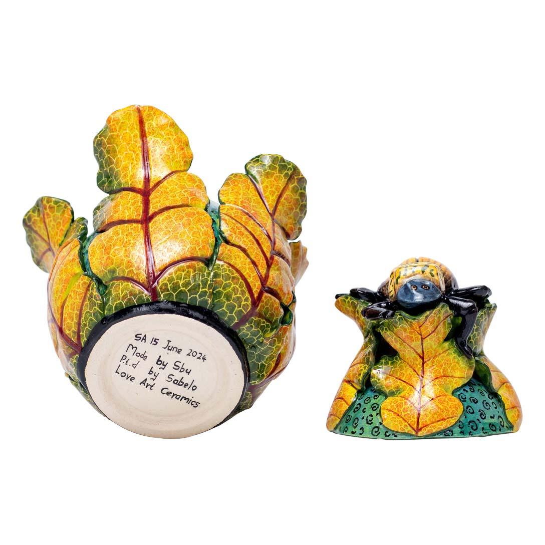 Beetroot Beetle Jewelry Box
Hand-Painted by Sabelo Nene, Sculpted by Sfiso Mvelase
Love Art Ceramic, South Africa, 2024

Introducing the Beetroot Beetle Jewelry Box, a captivating ceramic piece that celebrates the intricate beauty of nature.