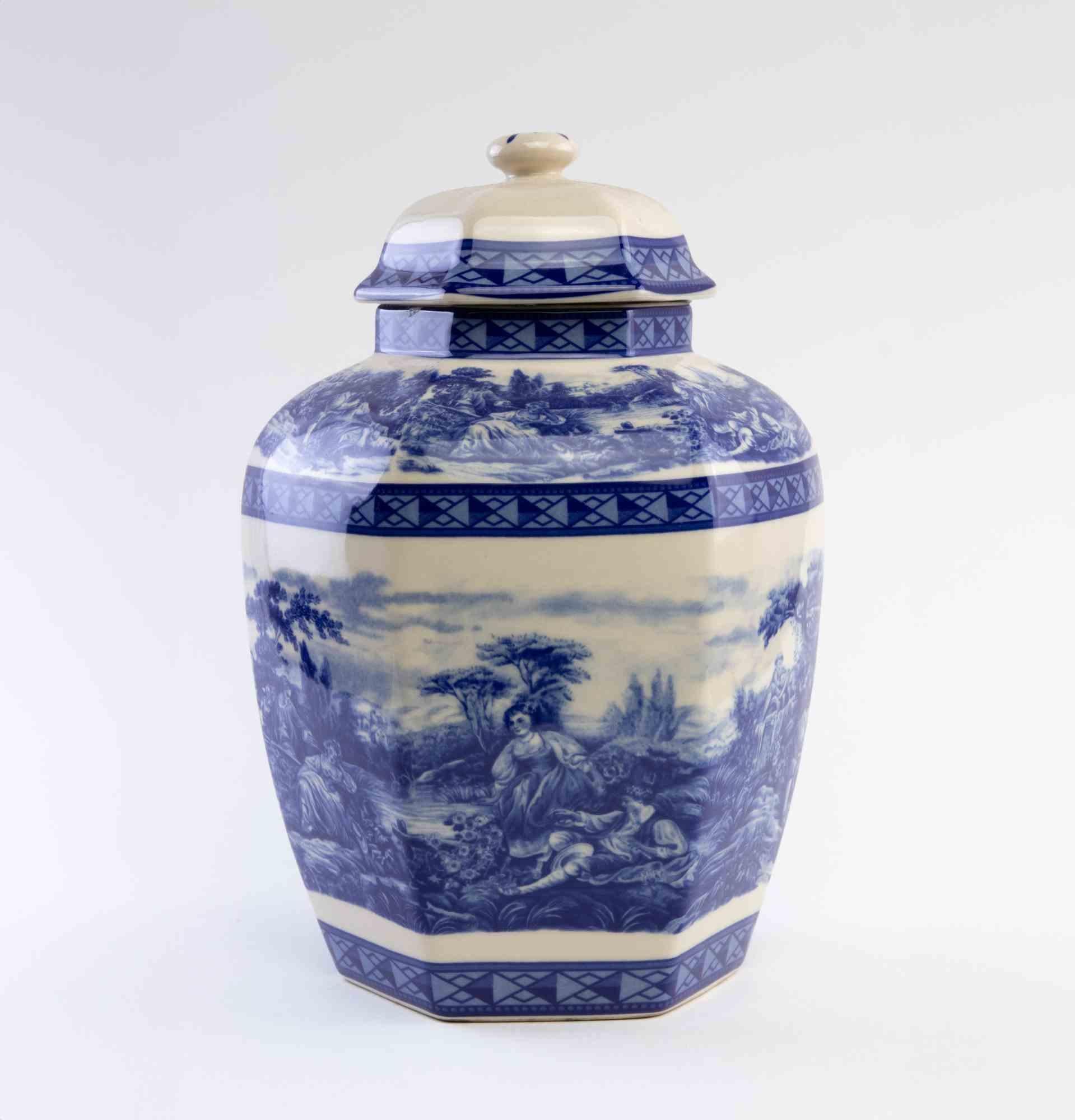 Ceramic Blue Decorative Object  is an elegant decorative object realized in the early 20th century.

A very elegant cand refined porcelain ornamental object with cover decorated with romantic blue colored genre scene.

A perfect object to add