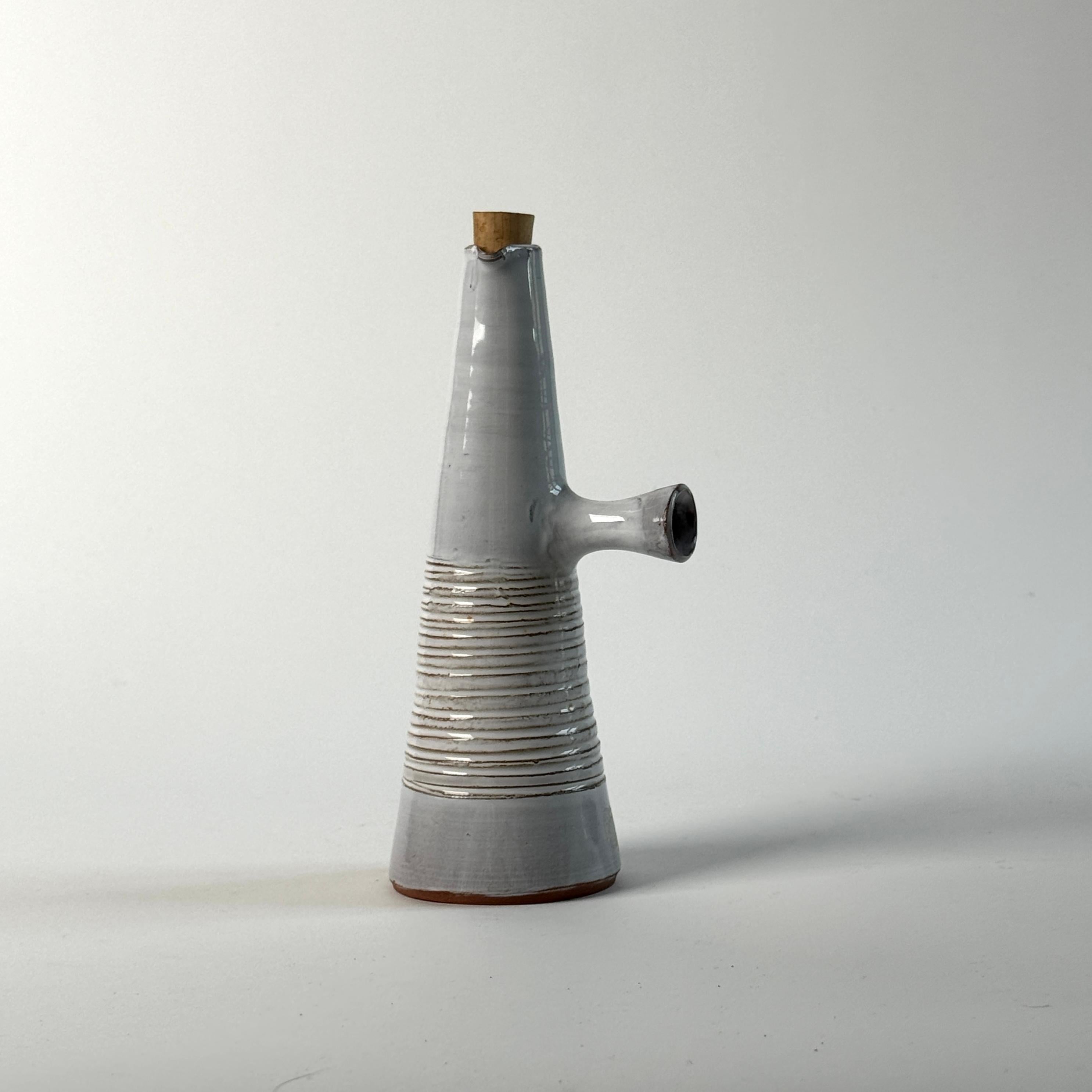 Ceramic bottle by Les Argonautes, circa 1960.

Isabelle Ferlay and Frédérique Bourget founded their Les Argonautes workshop in Vallauris in the early 1950s. Prominent figures in the history of ceramics from the 1950s to the present day.
Very good